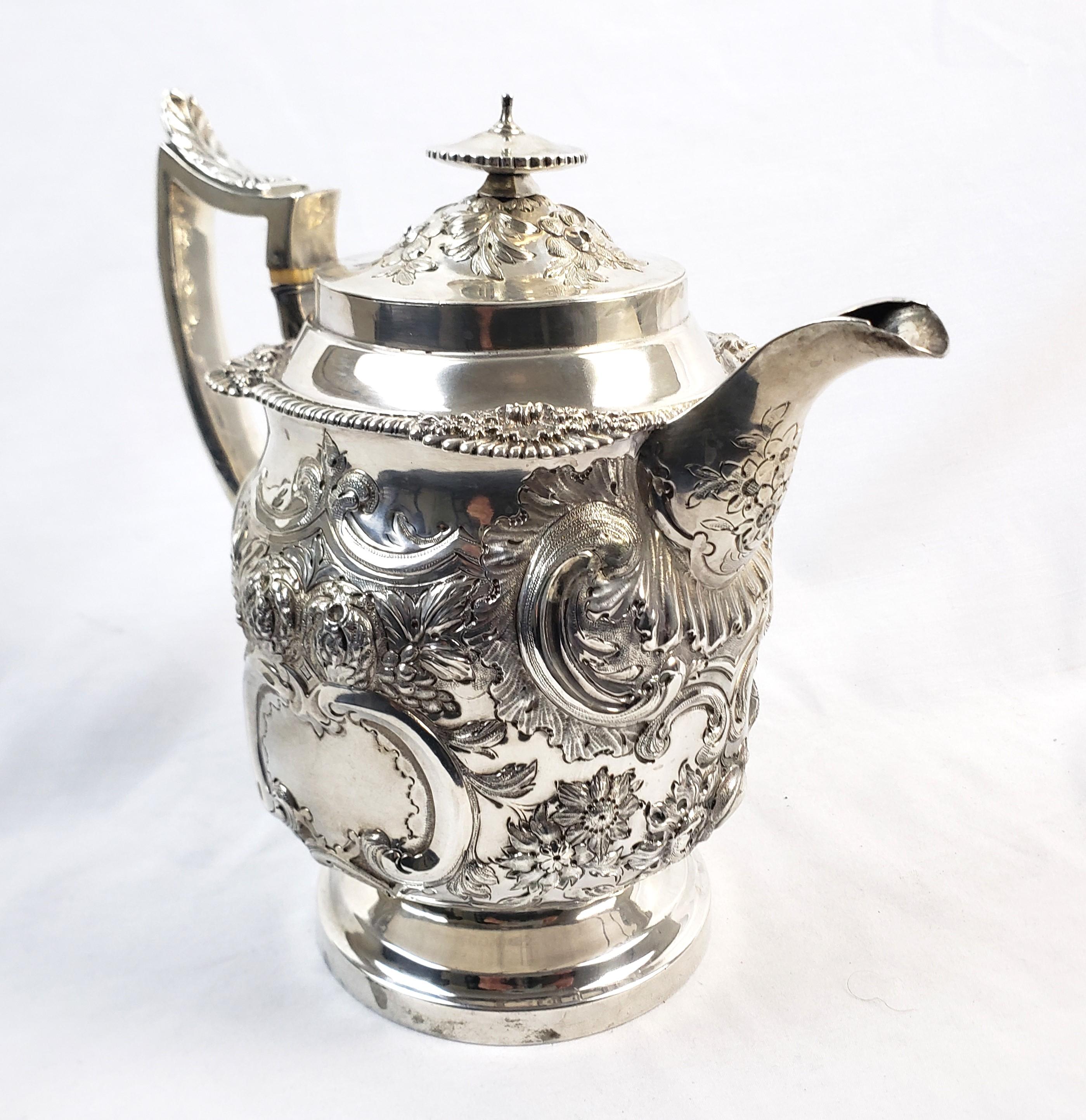 Hand-Crafted Large Antique Sterling Silver Georgian Teapot with Ornate Repousse Decoration For Sale