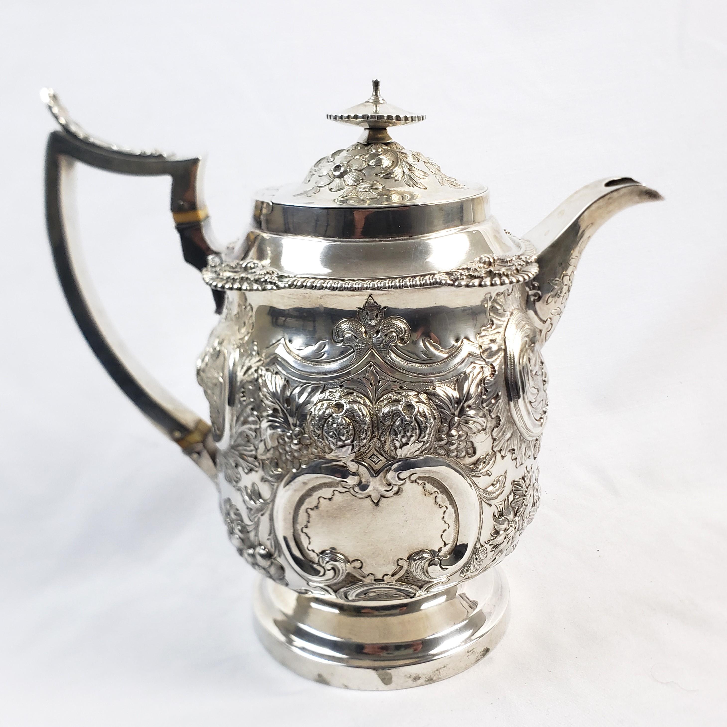 Large Antique Sterling Silver Georgian Teapot with Ornate Repousse Decoration In Good Condition For Sale In Hamilton, Ontario