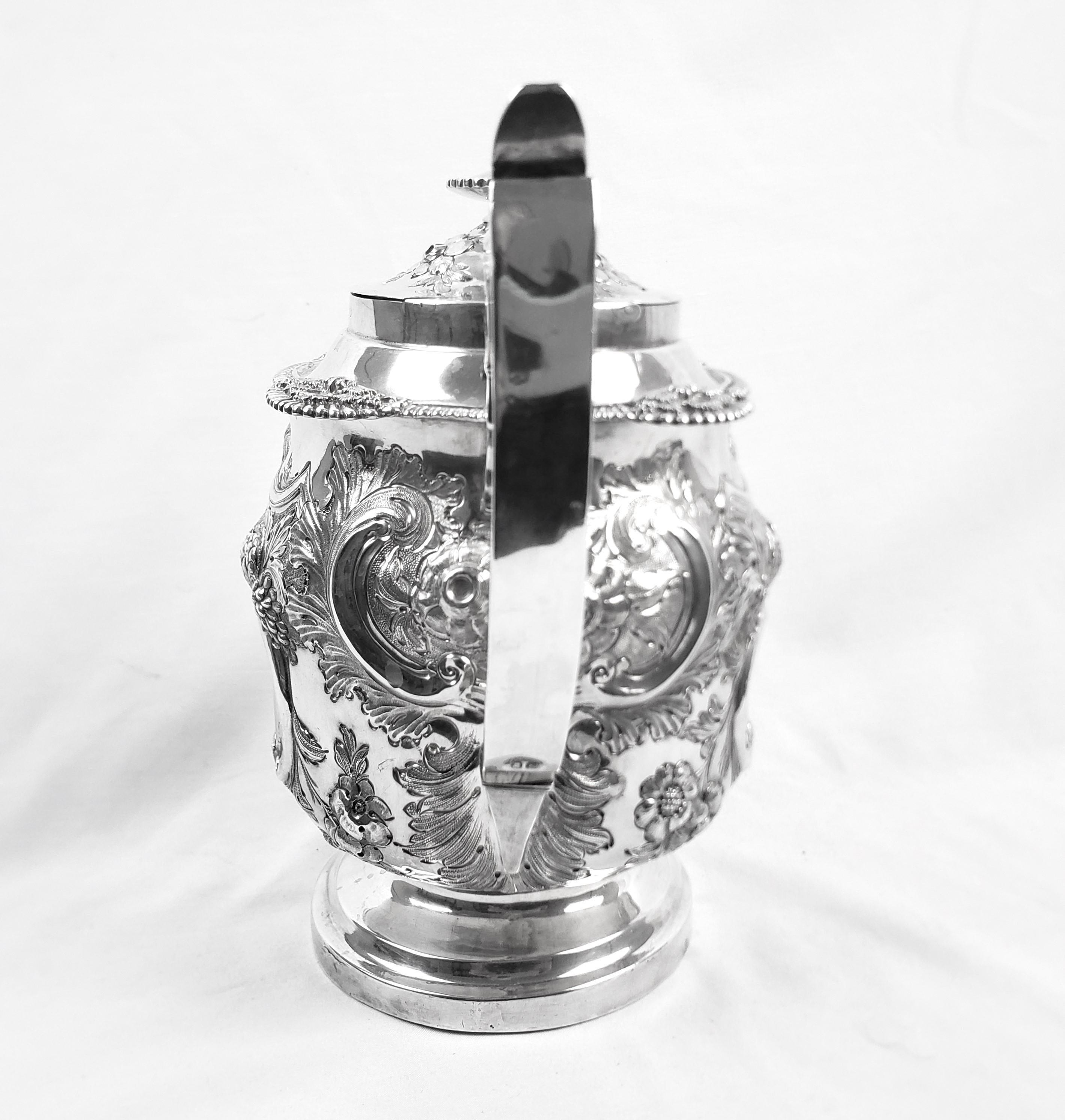 19th Century Large Antique Sterling Silver Georgian Teapot with Ornate Repousse Decoration For Sale