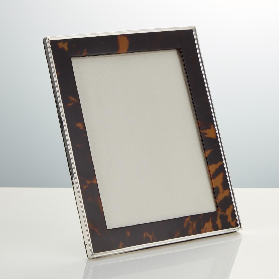 A beautiful silver and Tortoiseshell photo frame with great patina showing areas of light and shade which enhances the colour. It has its original back and strutt.
The Silver date Birmingham 1920.
Henry Matthews was a Birmingham based silversmith.