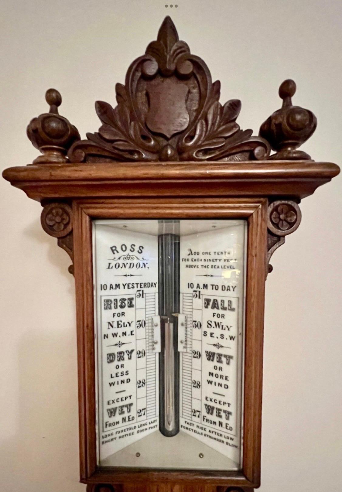 A magnificent large quality antique mercury stick barometer by Ross of London.
The oak case with a well carved pediment and turned finals. The dial having the original twin vernier scale adjuster with weather predictions from 27 to 31 and set