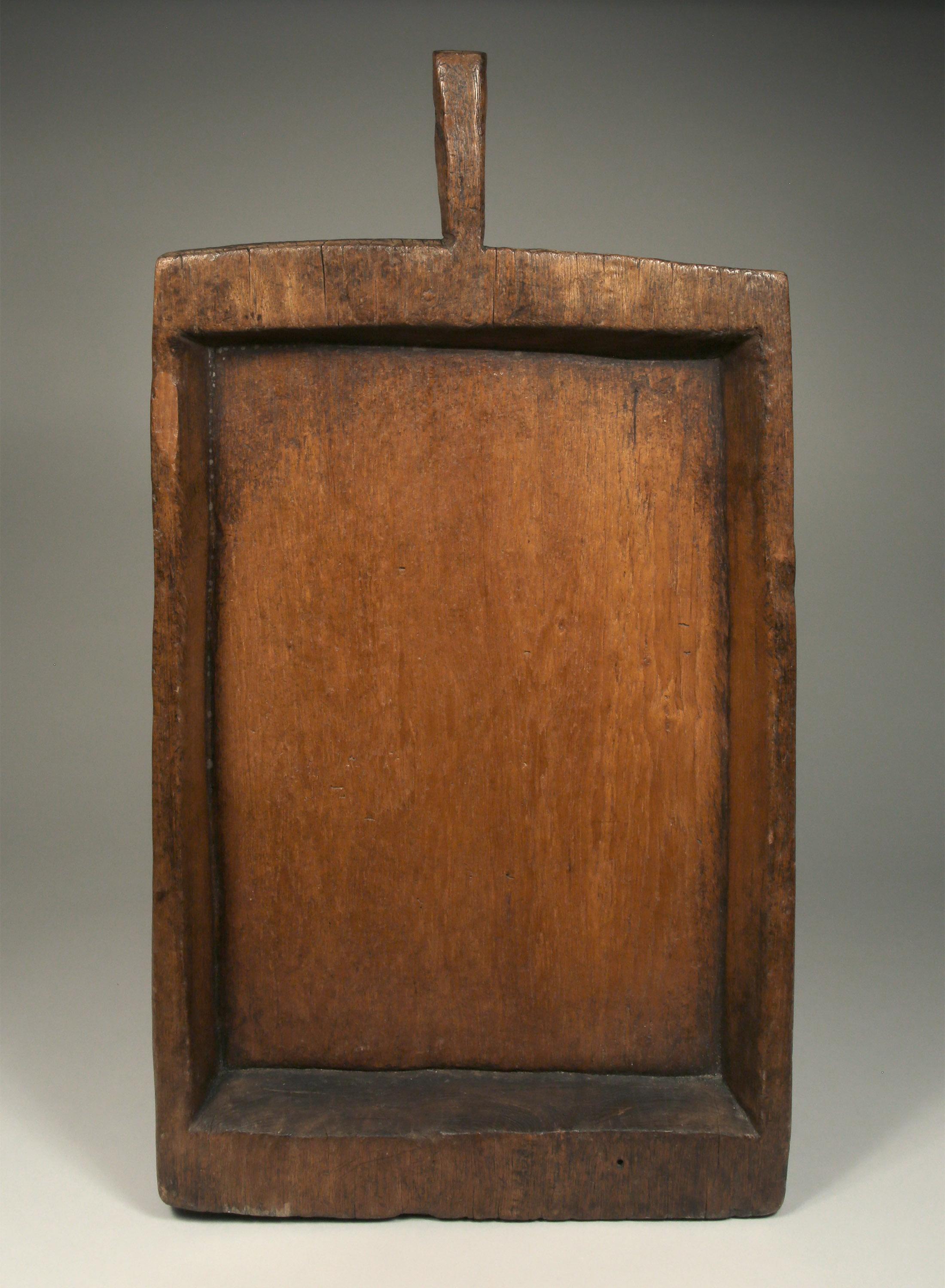 Large antique rectangular sticky rice tray (Kraboam) from Northern Thailand, early to mid-20th century.

Carved from one piece of dense teak wood including its handle.
Sticky rice trays were used to release the steam from cooked sticky rice