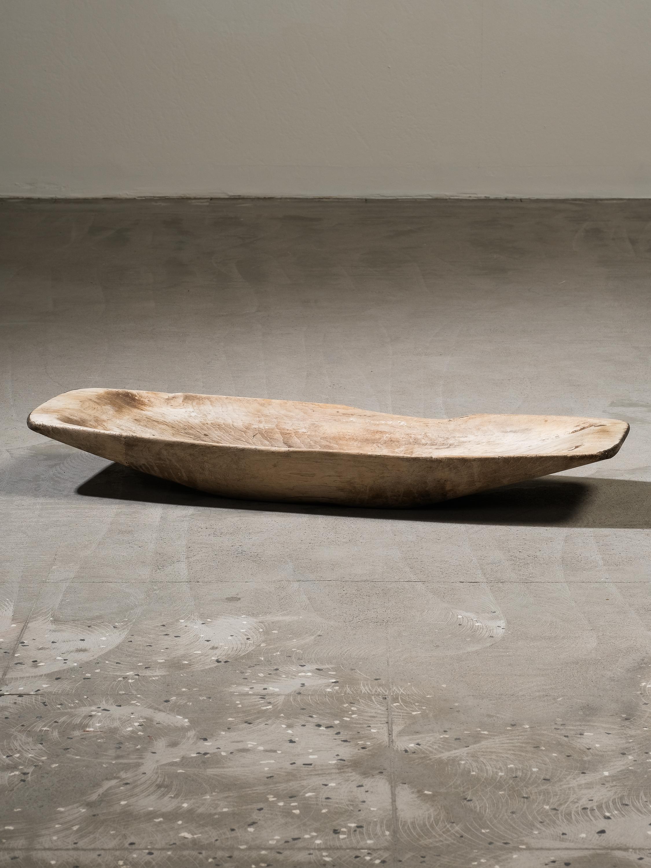 An antique wooden trough from 19th-century Sweden, hand-carved and uniquely authentic, featuring an ownership mark on the base. This piece carries many signs of its age, with an incredibly beautiful patina that reflects its long history.

This is a