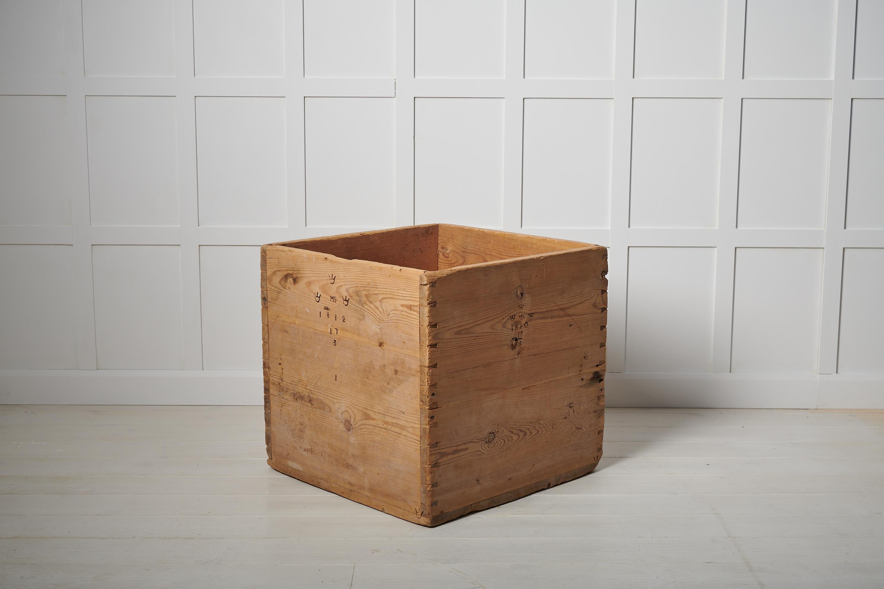 Large antique pine box in folk art from Sweden. The box is a measurement to measure volume and is made by hand in pine. It has never been painted and is marked with the tree crowns as well as years from 1812 to 1843 on all sides. Each mark is a