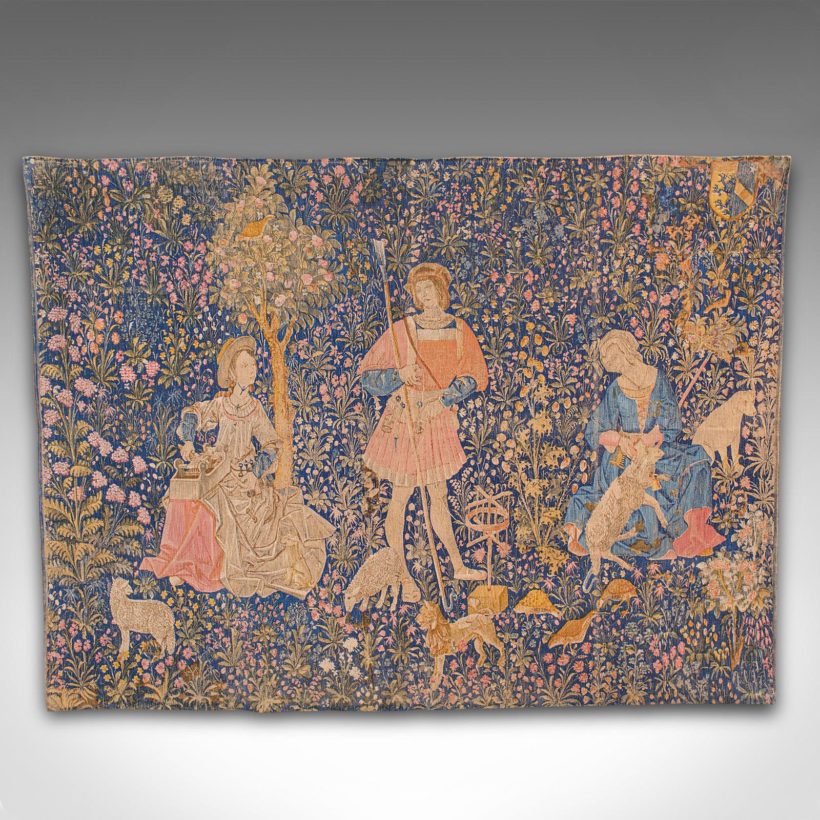 This is a large antique tapestry. A French, needlepoint decorative wall covering depicting wool workers in the Loire valley, dating to the early 20th century, circa 1920.

Of superior proportion, this tapestry is a quality recreation of a 16th