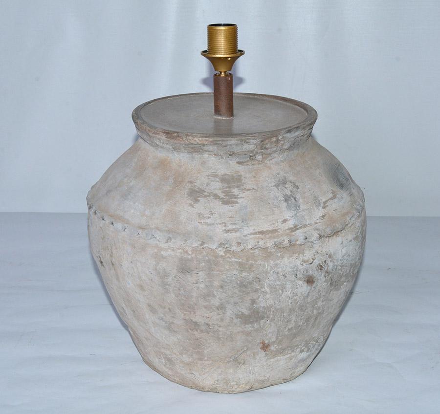 Early large rustic organic Chinese unglazed terra cotta storage jar that has been mounted as table lamp. The vase has beautiful aged patina from being buried perhaps for centuries. Handmade Belgium linen coolie shape lampshades included. Height with