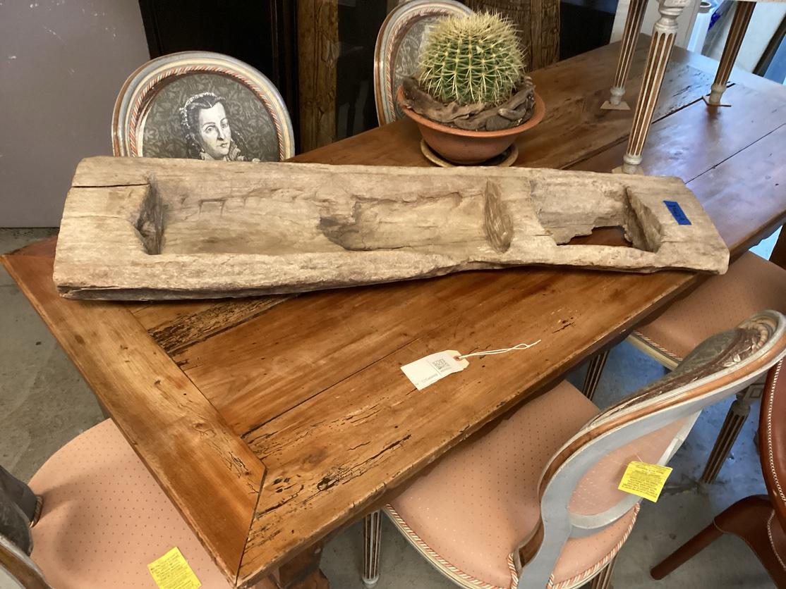 A phenomenal hand-carved wood double trough which through the processes of time and weather is now regarded as Found Sculpture. The wood is quite heavy and the age patina is excellent. Strongly worn, the smaller bowl section has been completely worn