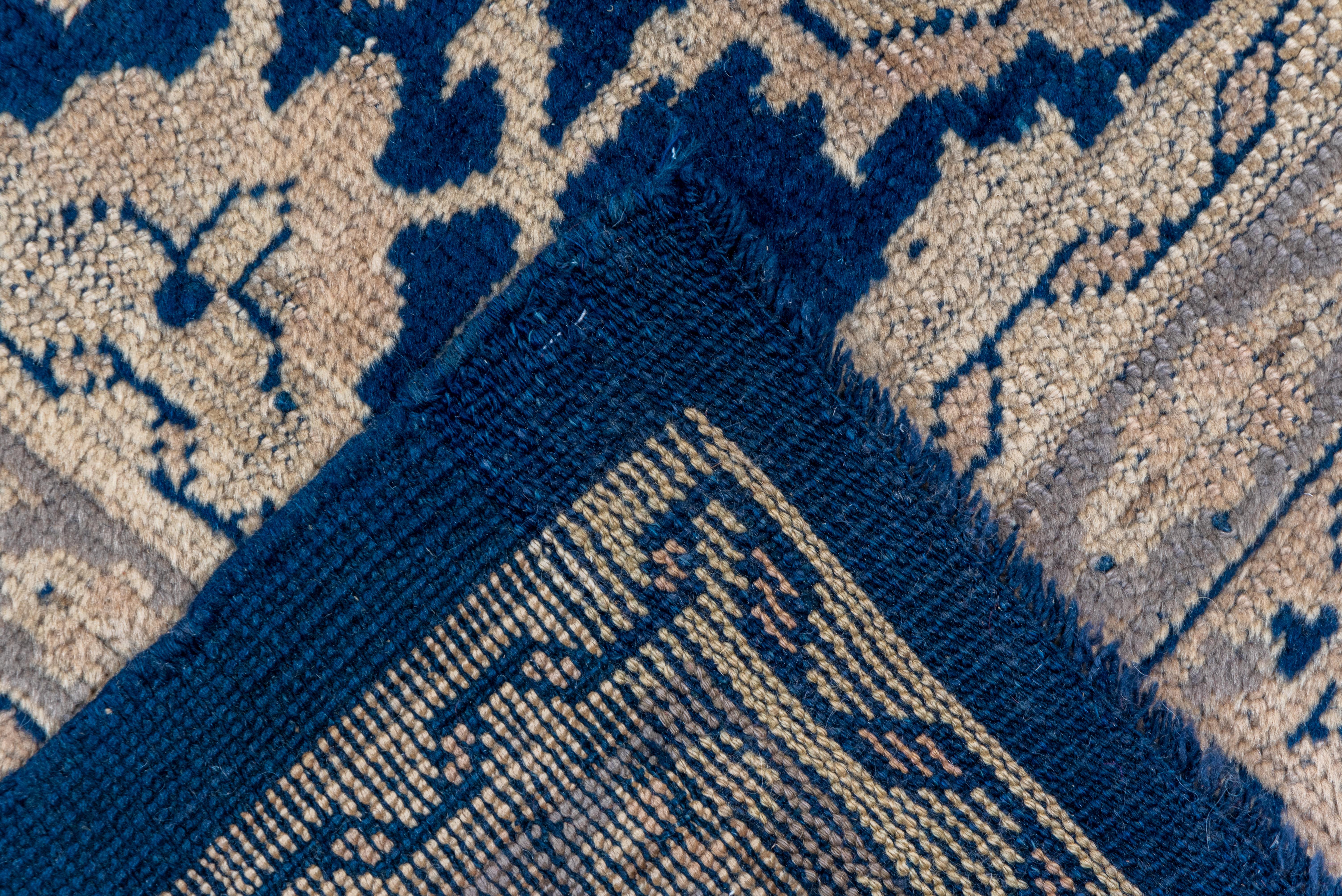 Wool Large Antique Turkish Oushak Carpet, Allover Dark Blue Field, Beige Borders For Sale