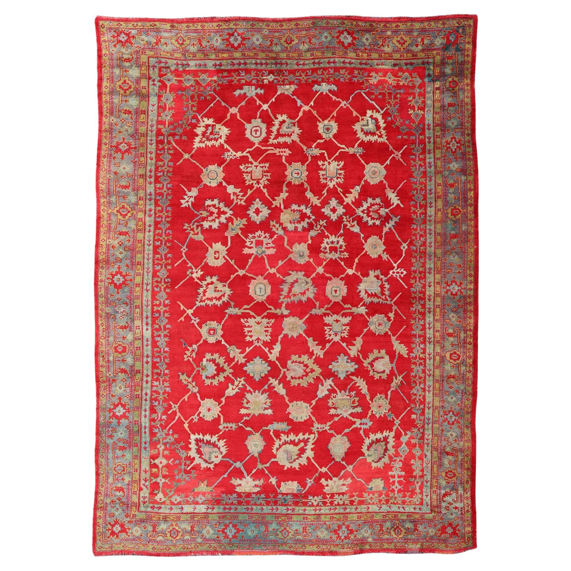 Large Antique Turkish Oushak Rug in Rich Red, Soft Ivory, and Muted Blue