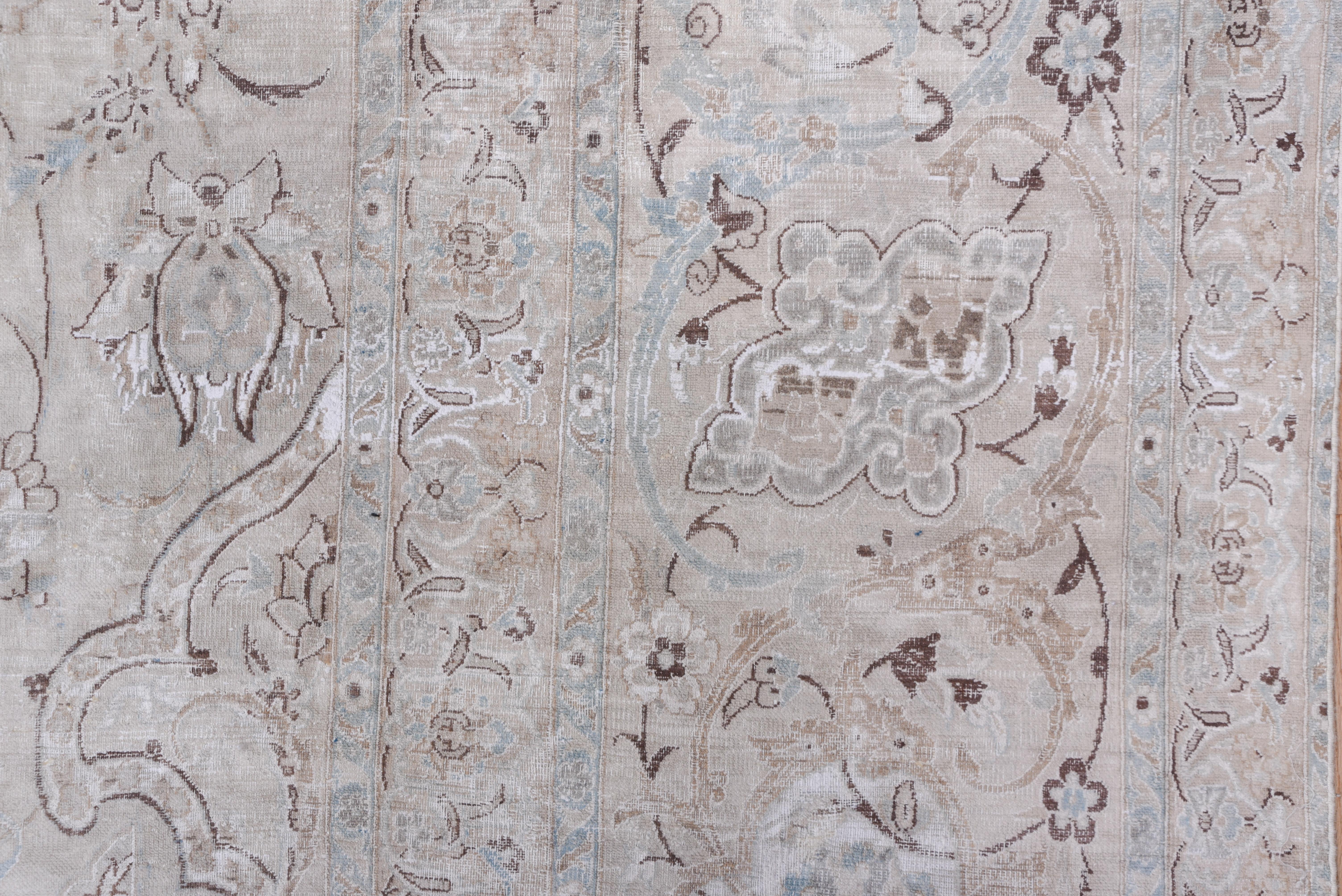 This eastern Turkish town carpet has an essentially tone-on-tone floral pattern on an eggshell ground. The border of this good condition interwar carpet continues the tonality and pattern of the field.