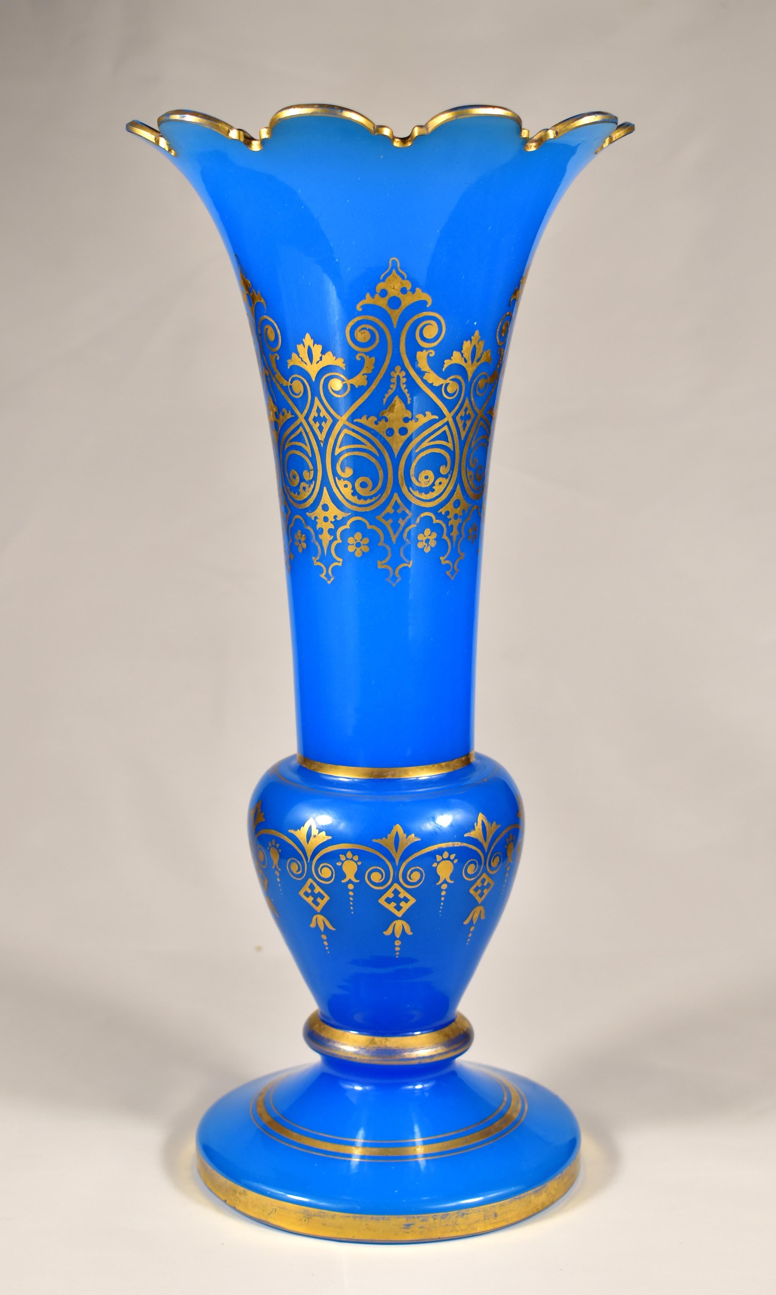 Large Antique blue opaline glass vase, The vase has a beautifully cut top, The body of the vase is decorated with an ornamental painting in a golden design, Completed with gold rims. it is probably Bohemian glass from the 19th century, which has