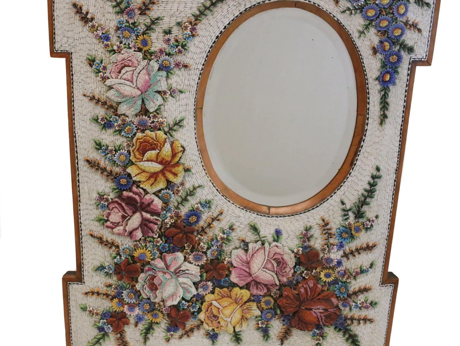 An exquisite antique Venetian micromosaic wall hanging mirror. The mirror has stunning micromosaic tiles depicting lovely floral designs. An oval shaped mirror to the upper right. Weight approximate, 15 lbs.



Measures approximate, Frame: