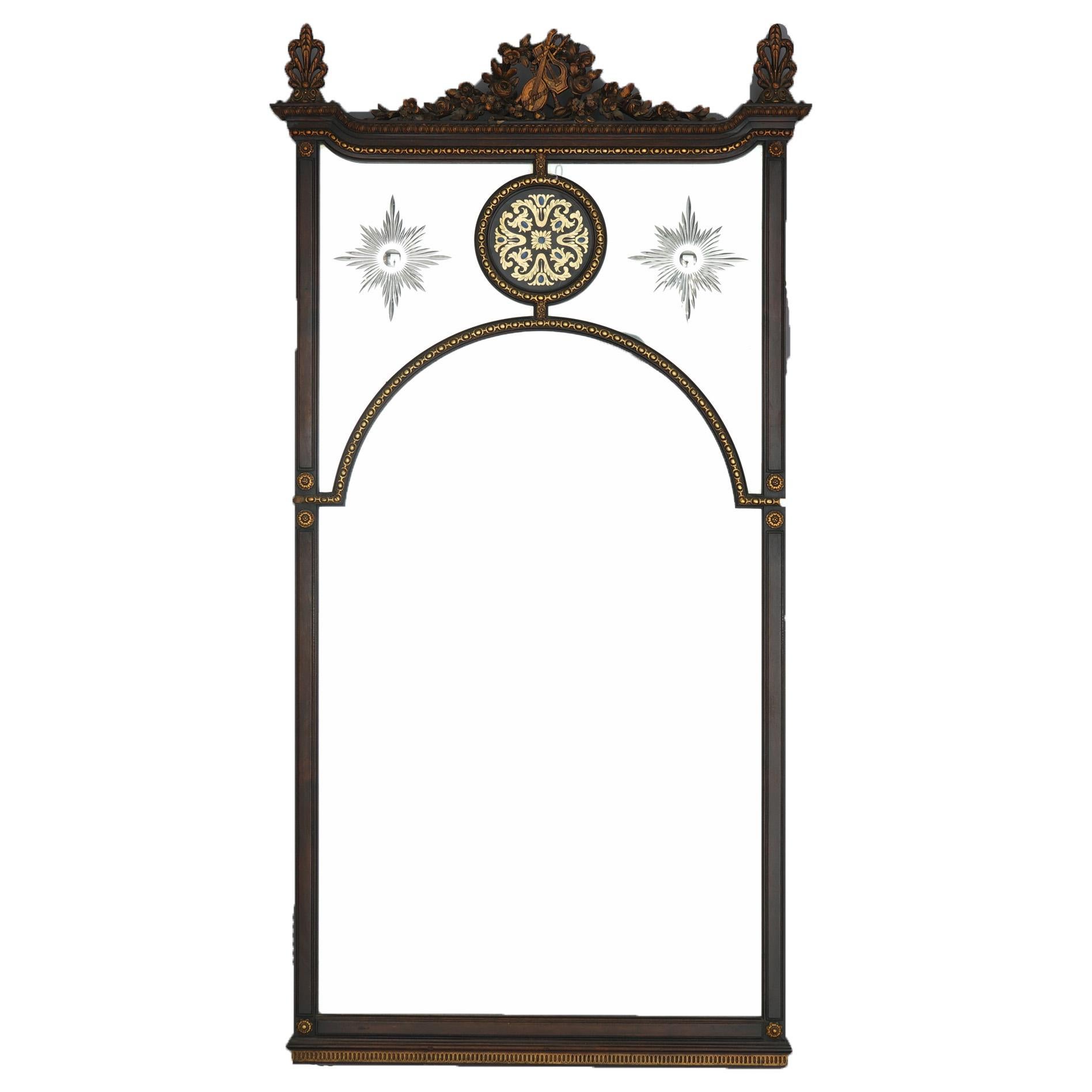 Large antique Venetian wall mirror offers paint decorated mahogany frame with carved foliate crest having central musical instruments (lute, lyre and clarinet) with flanking stylized palmette finials over paneled mirror with foliate medallion