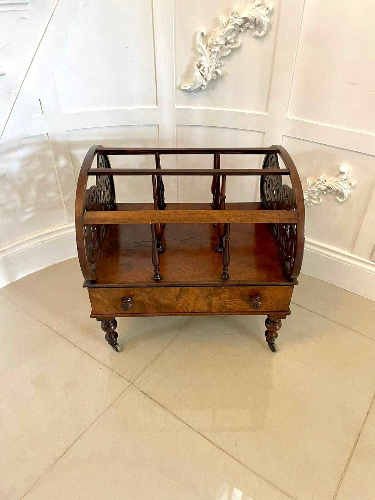 Large antique Victorian freestanding burr walnut canterbury having attractive oval shaped ends and pretty pierced fretwork with three divisions supported by baluster turned spindles. The base having one long drawer standing on turned solid walnut