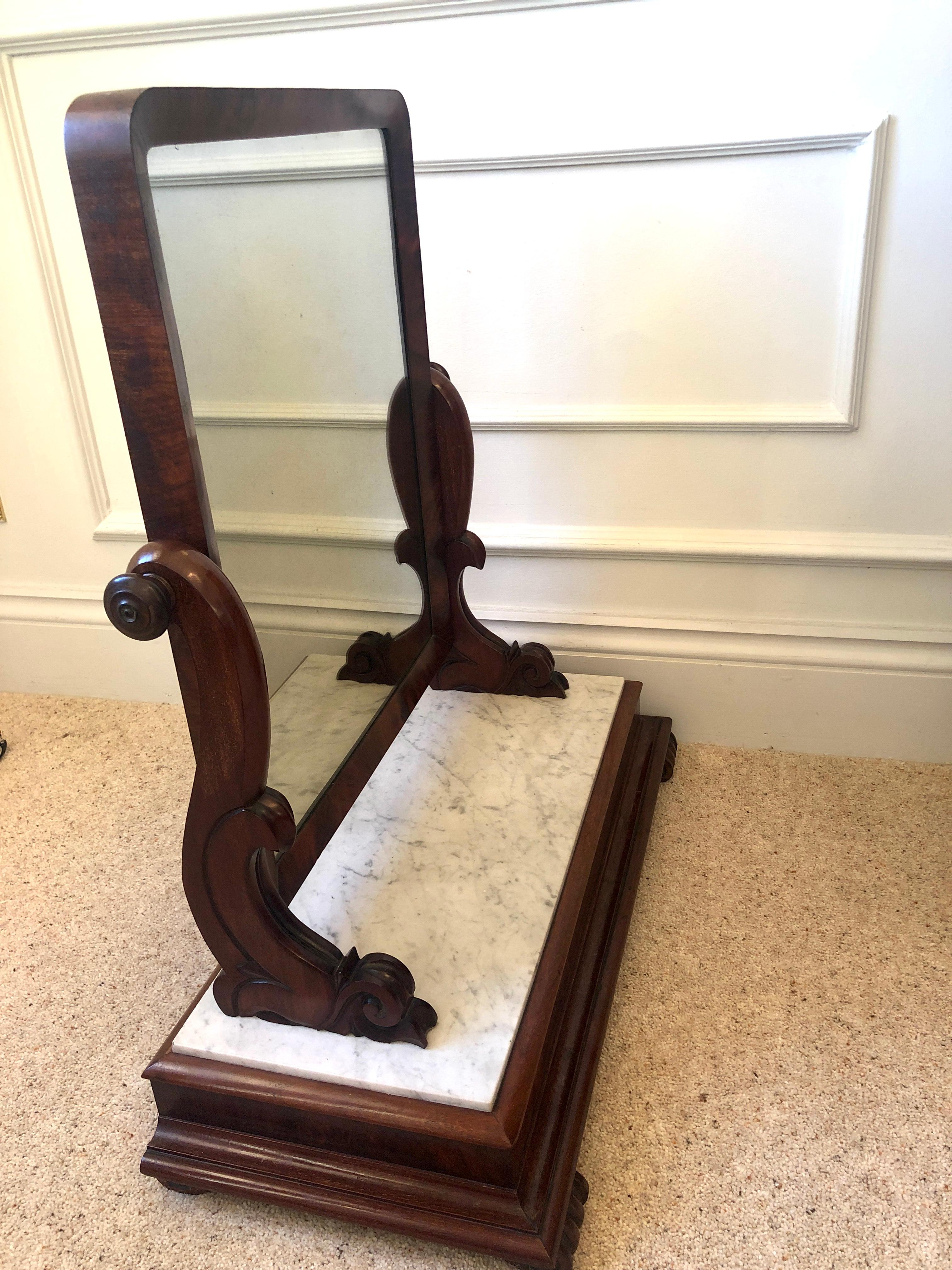 Large antique Victorian mahogany and marble topped toilet swing mirror having a lovely white marble topped mahogany plinth base with carved scrolled feet, the original mirror is supported by beautifully carved scrolled supports and to each side