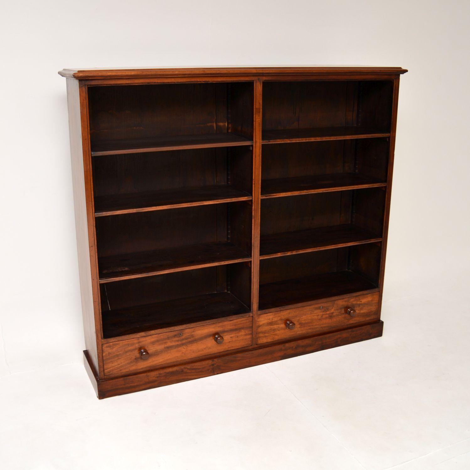 A smart and very well made large antique Victorian open bookcase. This was made in England, it dates from around the 1860-1880 period.

It is of superb quality and is a useful size. The two open sections each have three adjustable shelves, there are