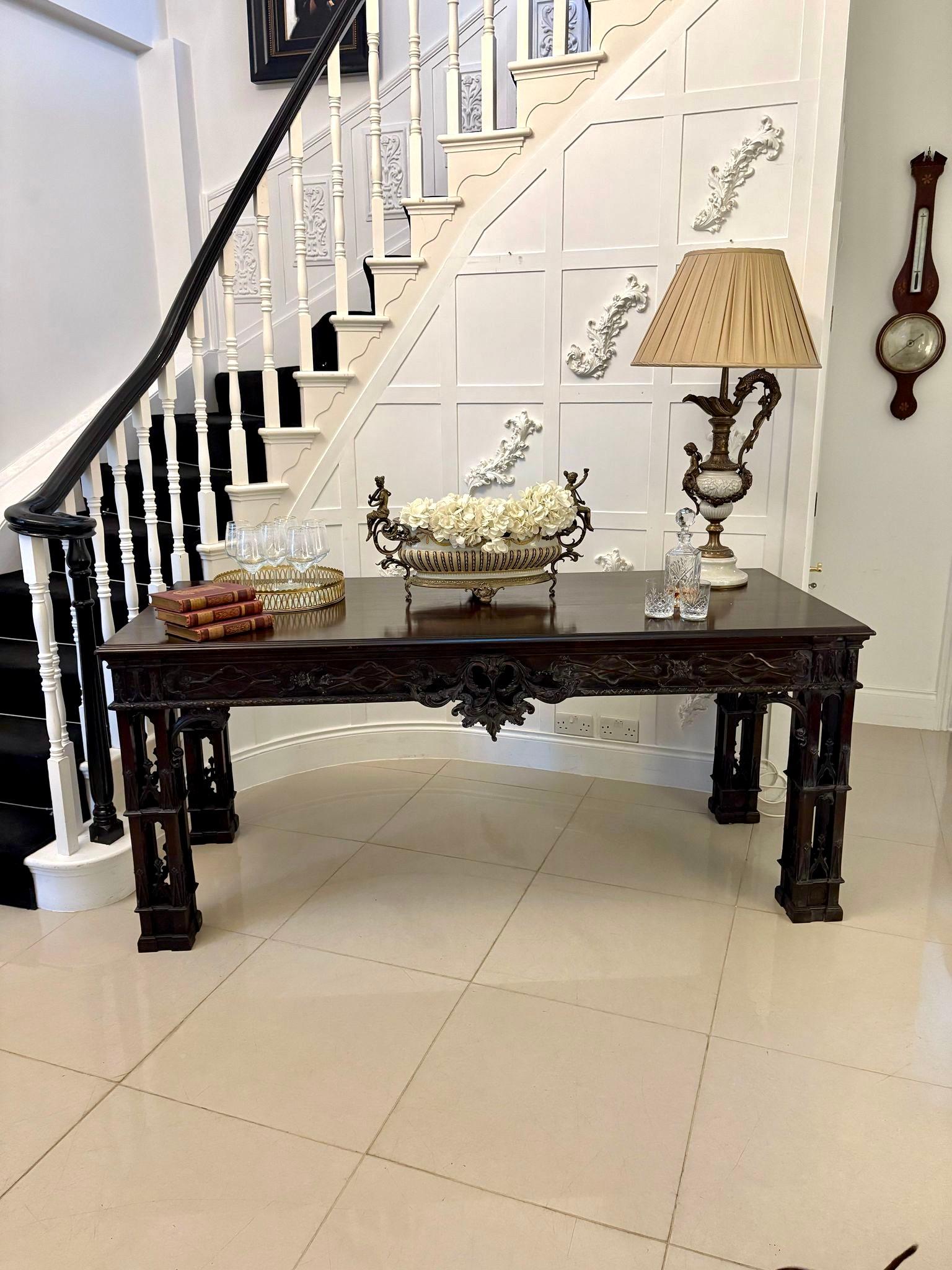 Large antique Victorian outstanding quality carved mahogany console table in the Chinese Chippendale manner
having a large quality mahogany top with a moulded edge above a magnificent quality carved blind fret and pierced frieze standing on