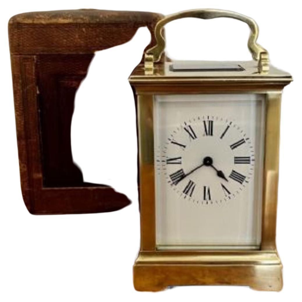 Large antique Victorian quality carriage clock having a quality large brass carriage clock with bevelled edge glass panels, a porcelain dial with Roman numerals and the original hands with an eight day French movement with the original leather