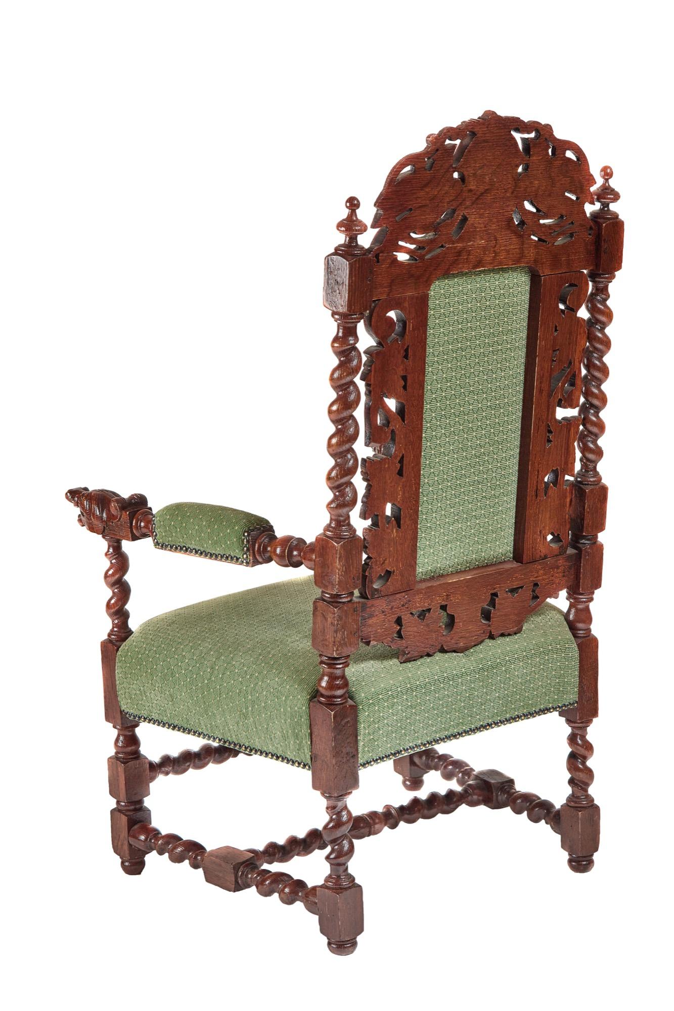 Large antique Victorian quality carved oak throne armchair having a quality carved oak back with super barley twist supports, open arms with quality carved dogs heads and barley twist supports standing on turned and carved legs to the front and 