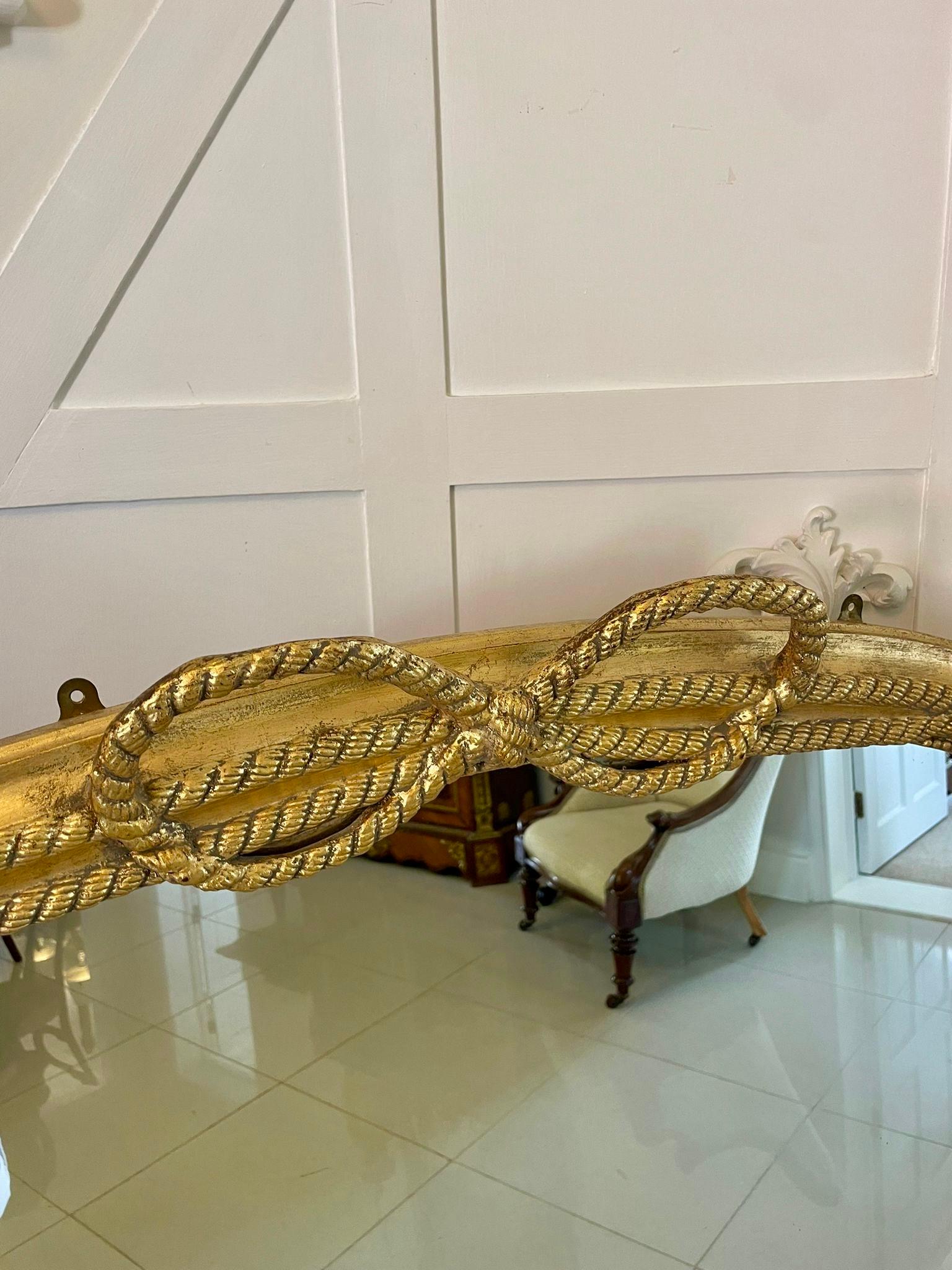 Large antique Victorian quality gilded overmantle mirror having quality carved gilded bow and ribbon decoration to the top and sides with original mirror plate

A beautiful decorative example in lovely original condition

Dimensions:
Height 140 cm