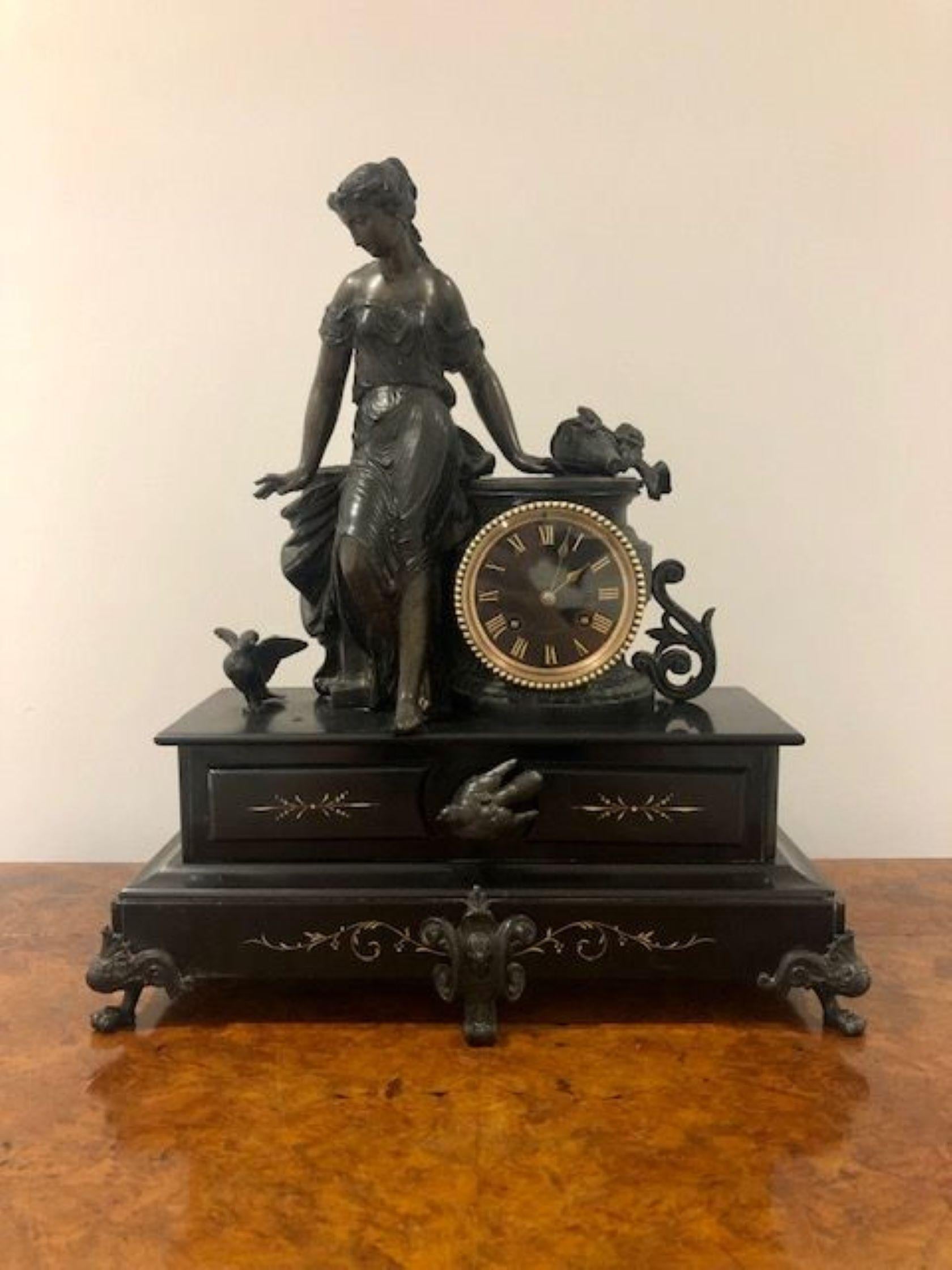 Large antique Victorian quality mantle clock, having a quality bronzed smelter figural mount of a lady with birds flanked by a circular ornate clock with a brass bezel and a bevelled edge, glass door opening to reveal the circular dial with original