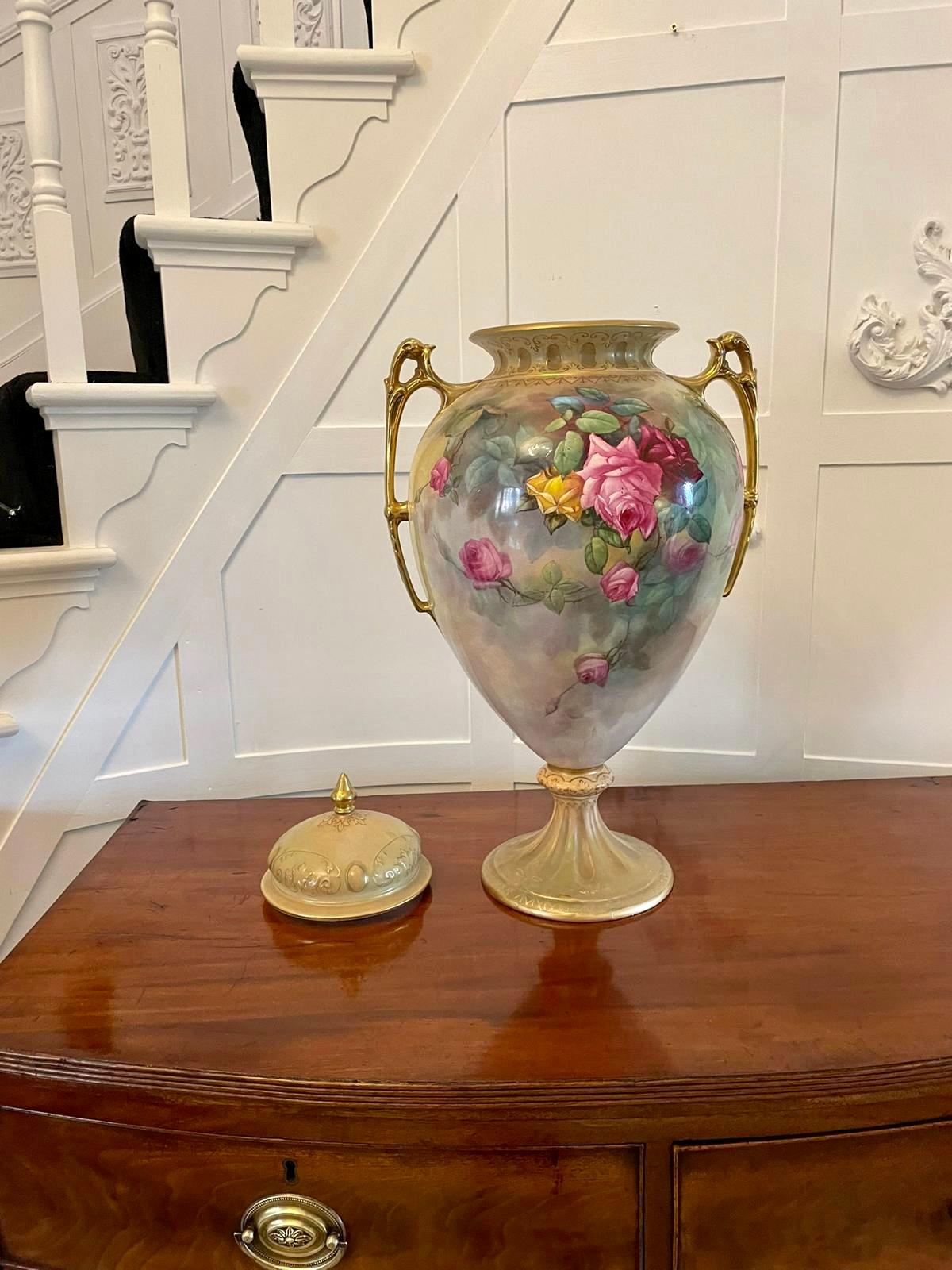 Large antique Victorian quality royal crown Devon lidded vase having a quality Royal Crown Devon lidded vase with wonderful hand painted flowers in superb red, green, blue and  yellow colours with gold gilded shaped handles 

In wonderful original