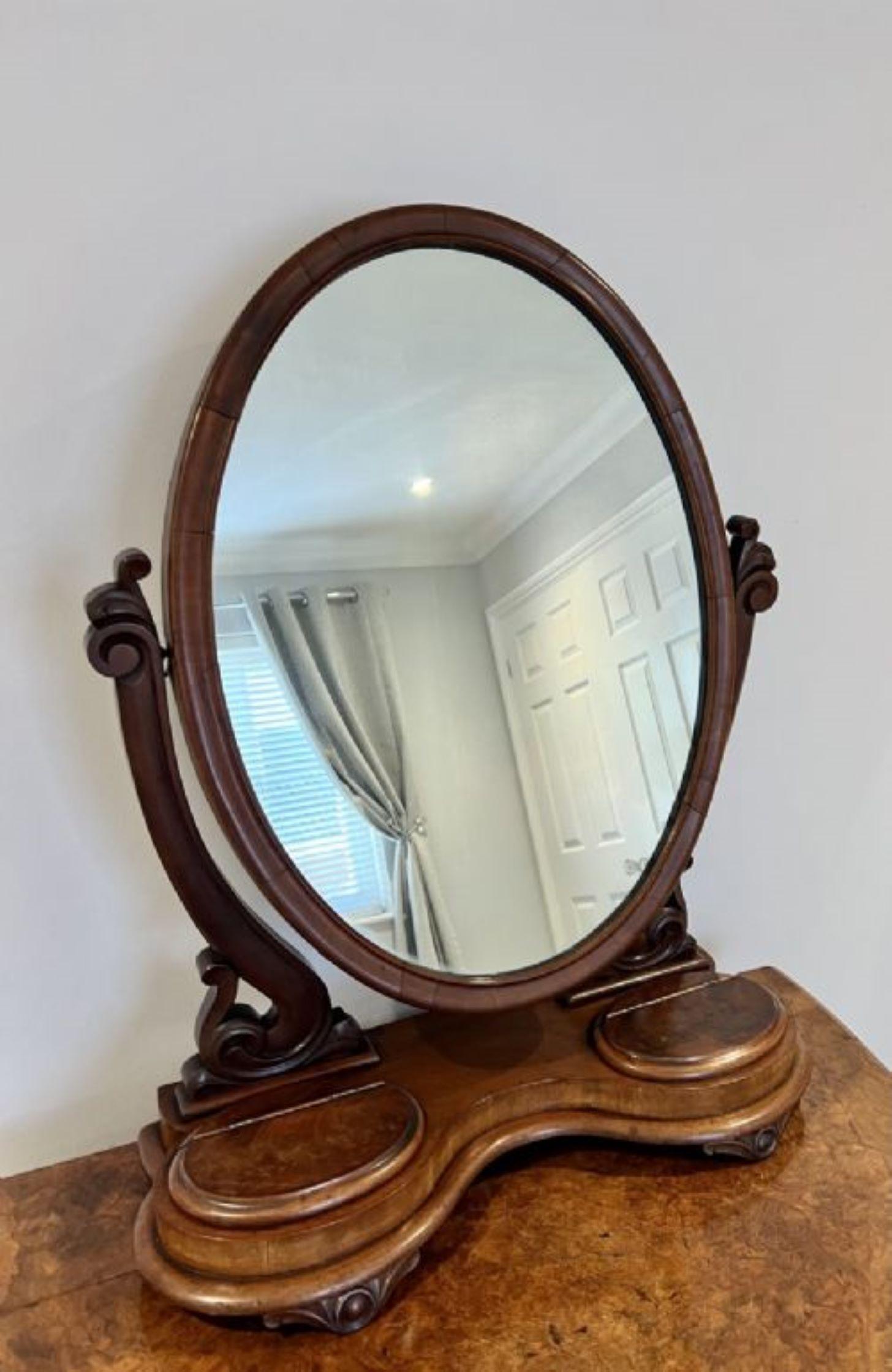 Large antique Victorian quality walnut dressing mirror, Large antique Victorian dressing table mirror having a quality oval walnut swing mirror supported by carved walnut shaped supports, standing on a serpentine shaped base with two oval lift up