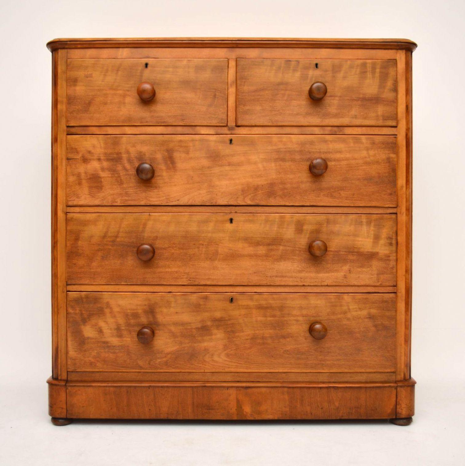 Large chunky antique Victorian chest of drawers in satin birch with a lovely silky finish on the surface. All the drawers are deep and graduated, while the bottom drawer is extra deep, because it is attached to the plinth. The drawers also have
