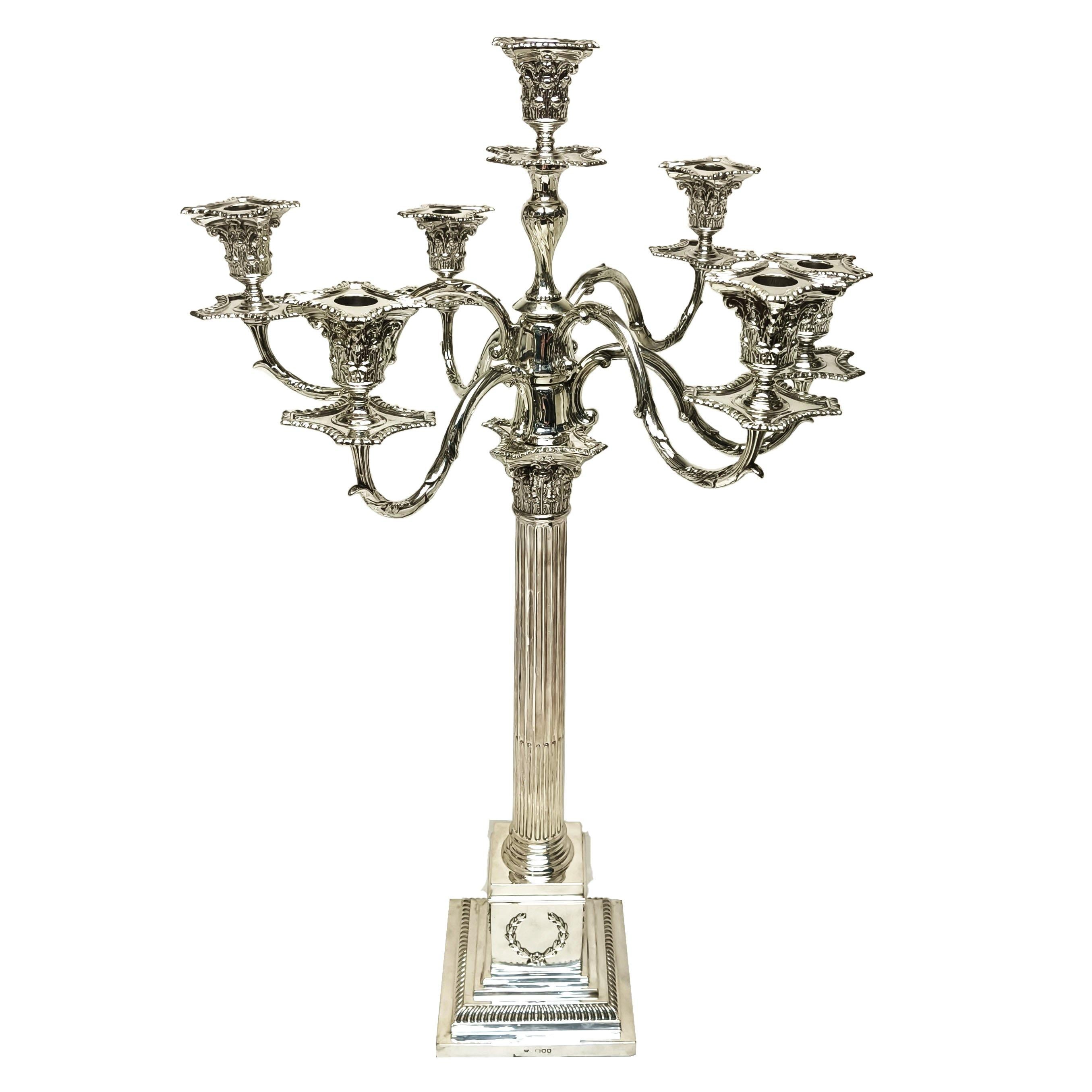 An impressive Antique Victorian Sterling Silver 7 Light Candelabra in a classic Corinthian Column style. This magnificent Silver Candelabra is of notably large size. (Shown with a standard size Champagne Bottle for comparison).

This Candelabra has
