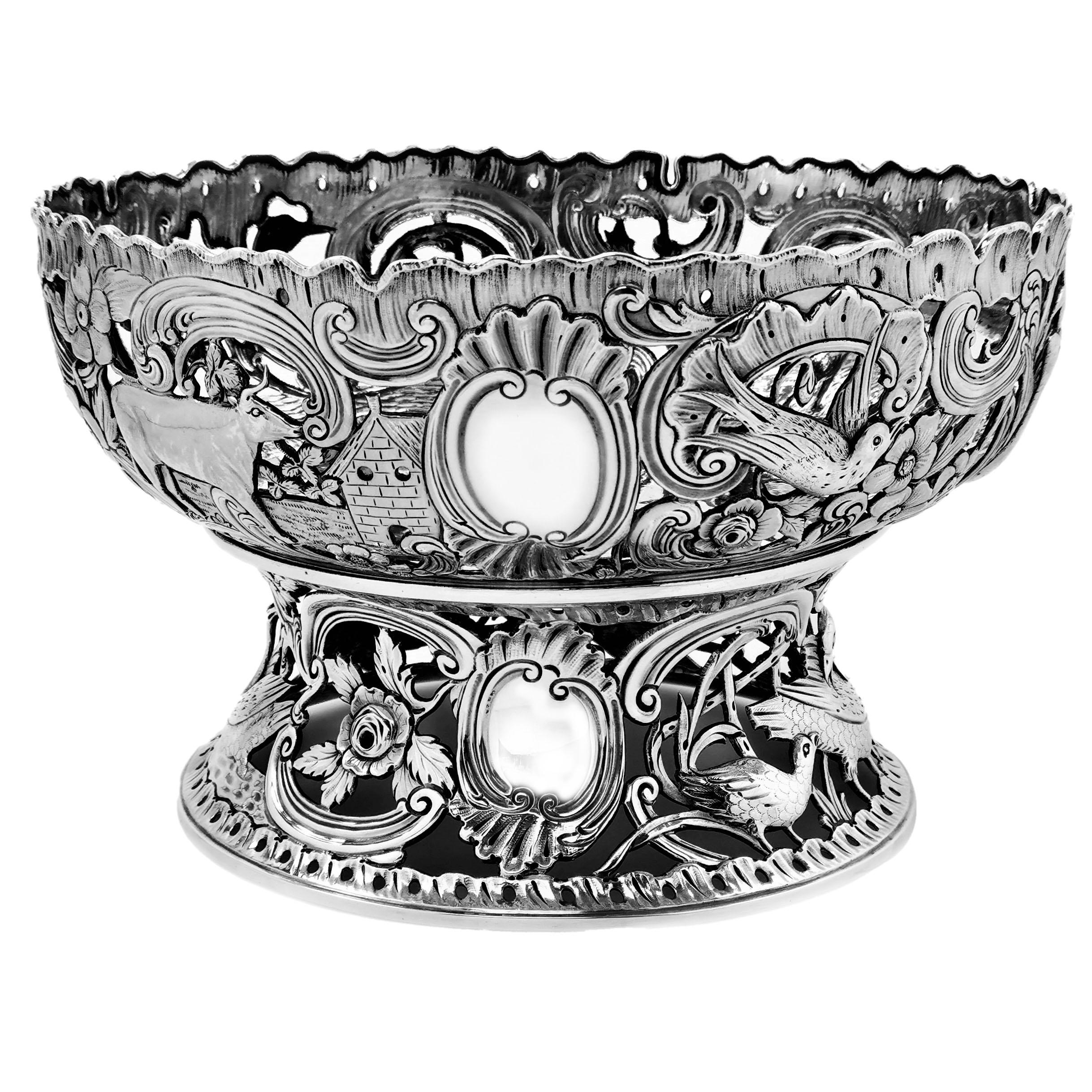 A magnificent Antique Victorian Silver Dish Ring with matching Bowl / Dish created in the typical antique Irish Georgian Silver Dish Rings. This a particularly fine example with a gorgeous, detailed chased and pierced scenes on both the Dish Ring