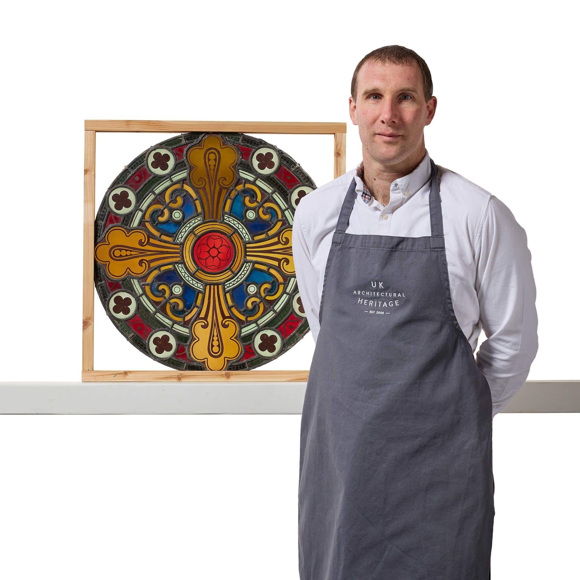 A large ø59cm antique Victorian, post-medieval stained glass roundel. If looking for a pair, we are also selling another roundel in exactly the same design.
 
Dating from circa 1850, this antique stained glass window features a vibrant array of