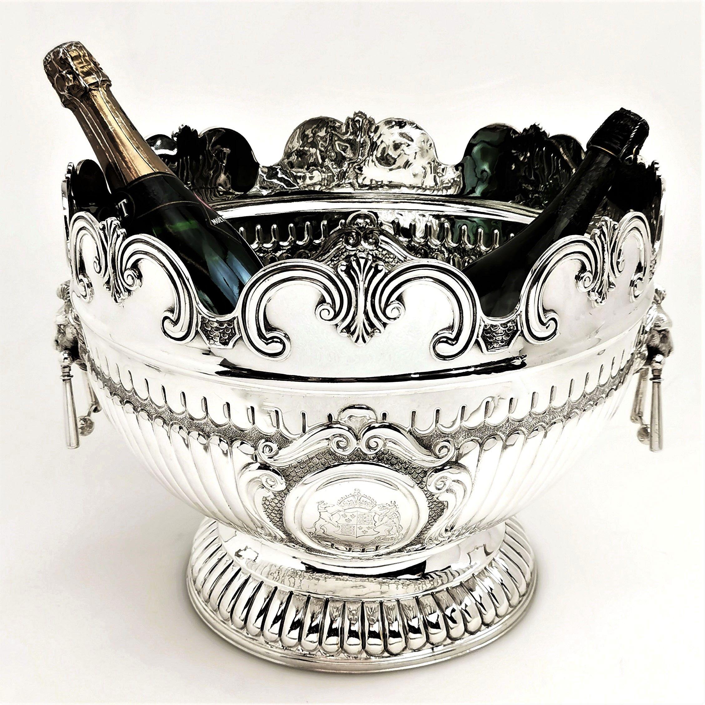 A magnificent Antique Victorian solid silver bowl. This Queen Anne Monteith style inspired punch bowl is of substantial size and is perfect for punch. It can also easily accommodate 4 bottles of champagne. The Bowl has a chased fluted design on the