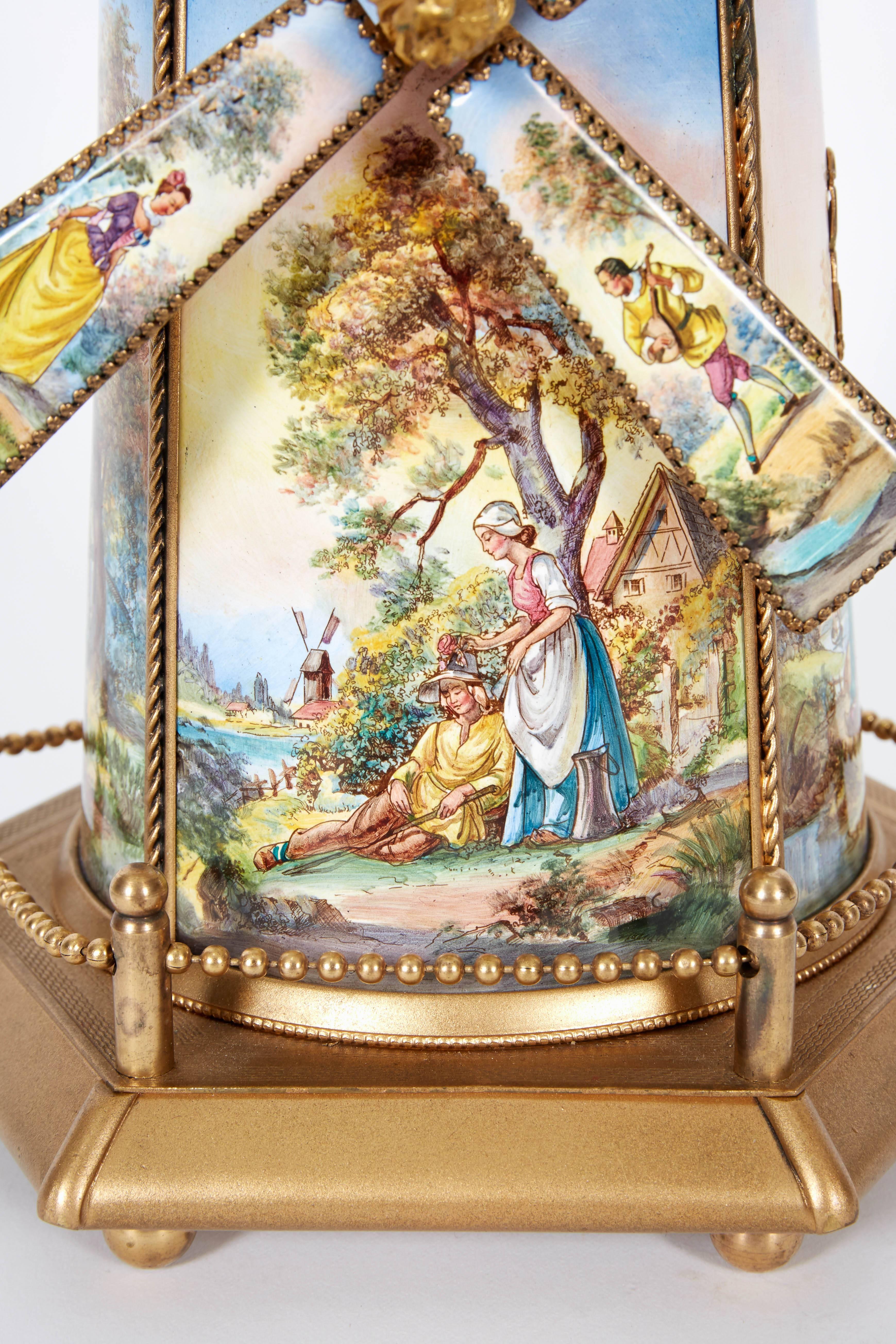 A large antique Viennese / Austrian enamel and bronze Windmill Musical jewelry box and cover,
circa 1910

Hand-painted, windmill form box and cover. Plays music when you wind it, windmill turns when music is being played.

Excellent