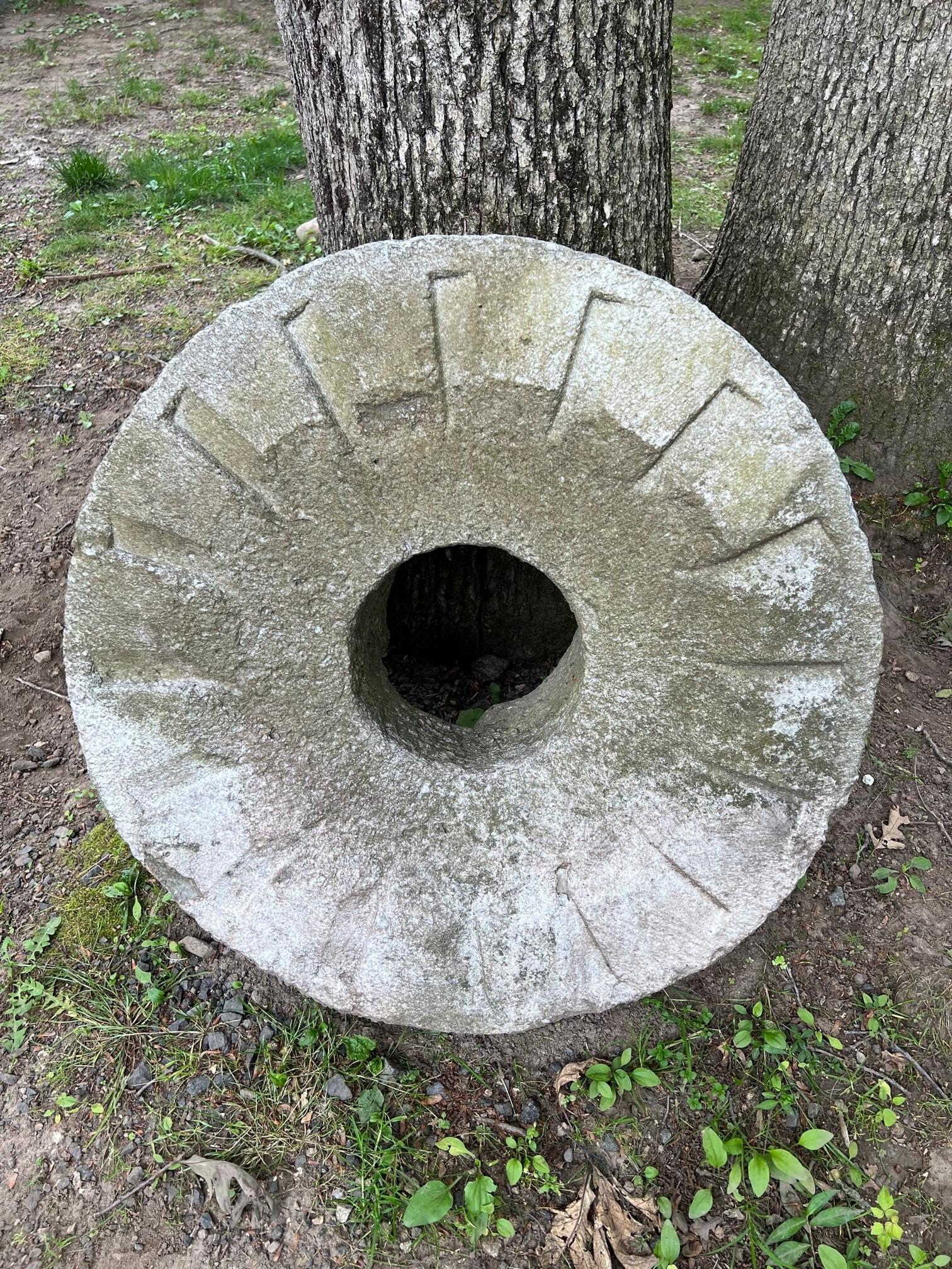 Antique vintage Millstones or Mill stone used in gristmills, for grinding wheat or other grains. They are sometimes referred to as grindstones or grinding stones. Millstones have always been a symbol of both the harvest and hospitality and make a
