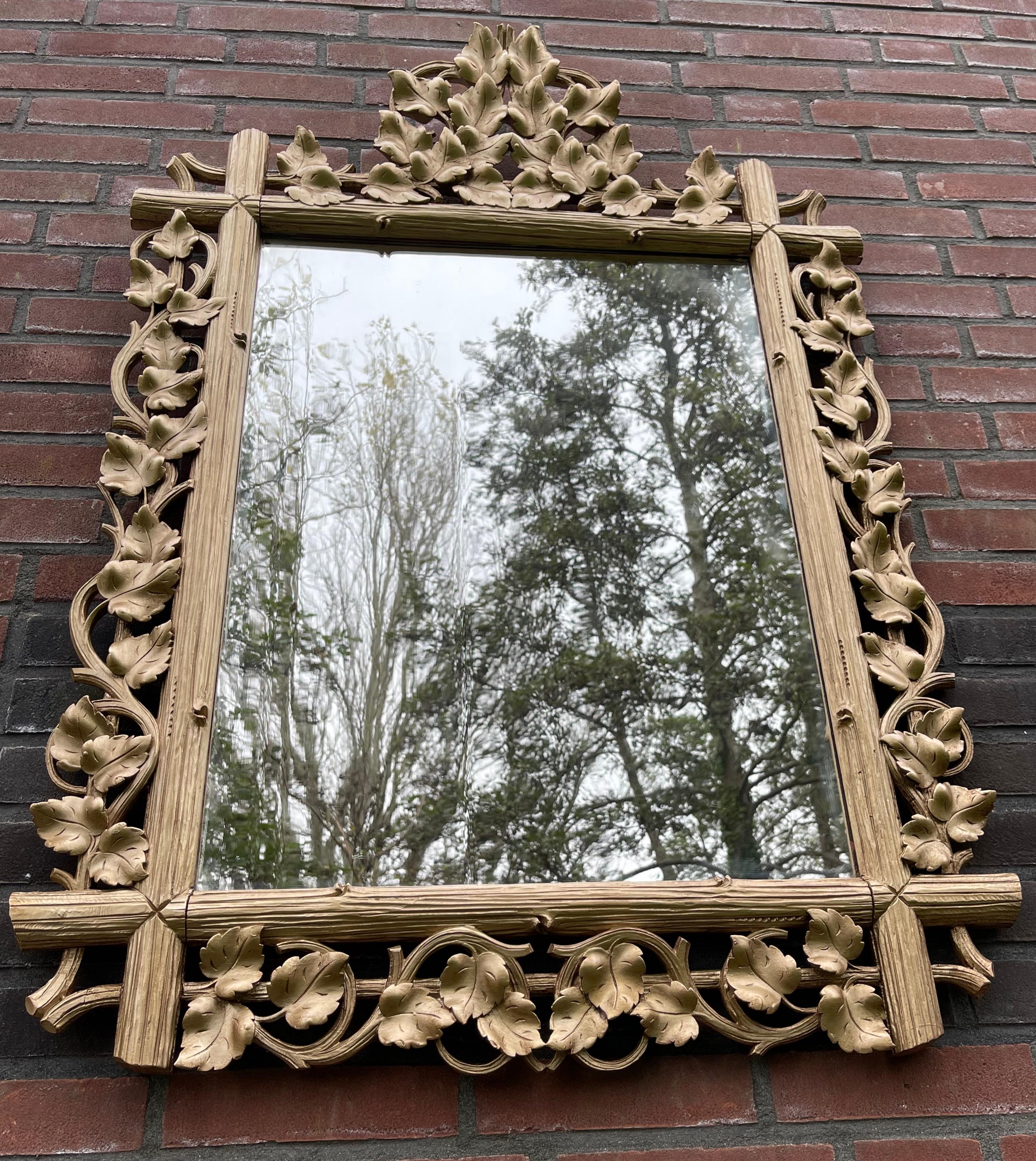 Antique, one of a kind and highly decorative organic hand carved mirror. 

This beautiful, golden color refinished, hand-carved mirror frame with the original mirror from the late 19th century is in great condition. It is perfectly hand carved