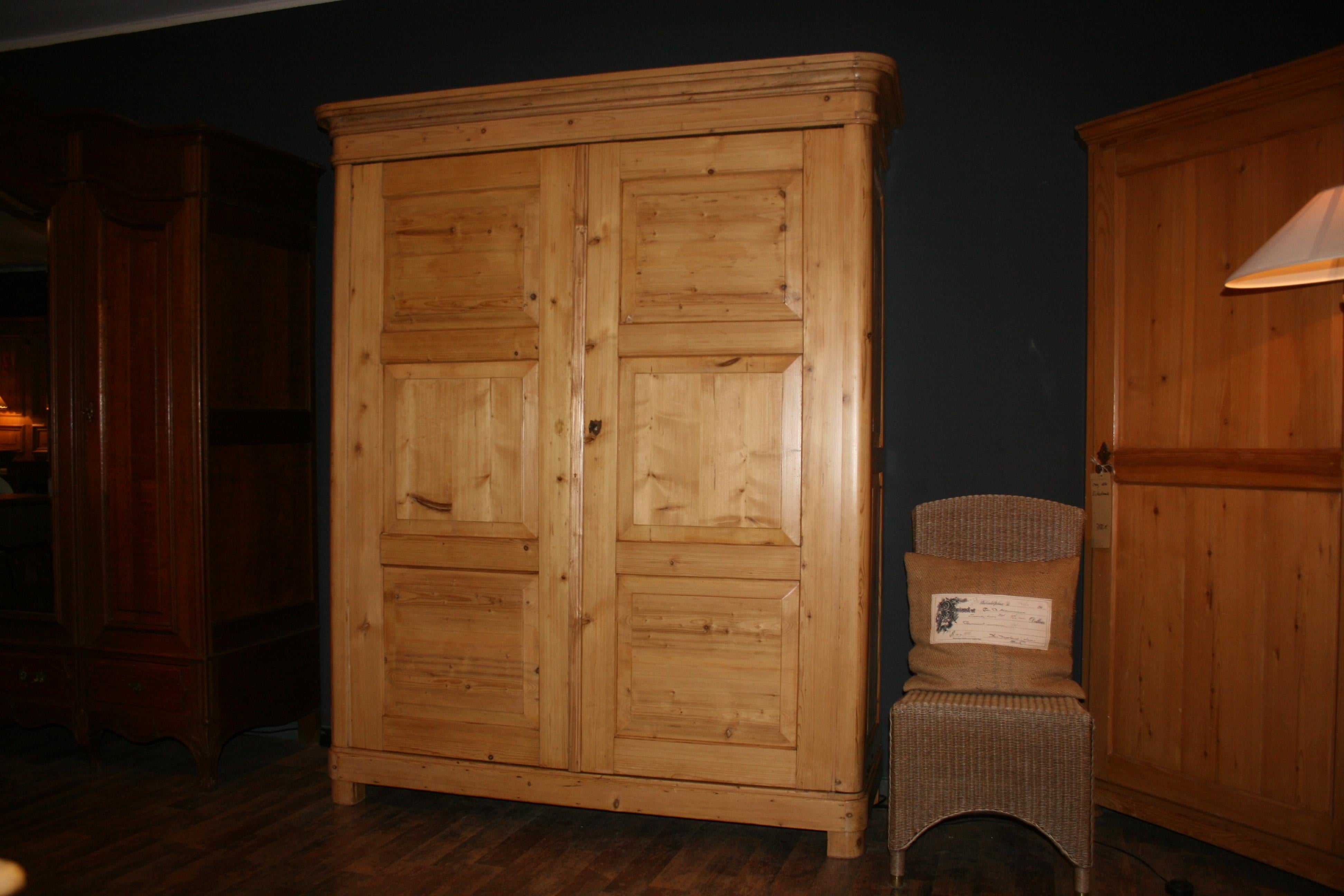 Large East Frisian (northeastern Germany on the Baltic Sea) 2-door wardrobe made of pine. Completely restored and revised. The entire cabinet was sanded by hand and then sealed by hand several times transparent. Thus, the beautiful softwood patina