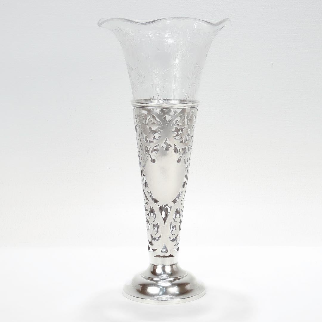 A fine large scale antique flower vase.

In sterling silver with an etched and cut glass insert.

Manufactured by Watson Silver Co. and retailed by Bailey, Banks, and Biddle.

Fully hallmarked to the base. 

Simply a wonderful antique American