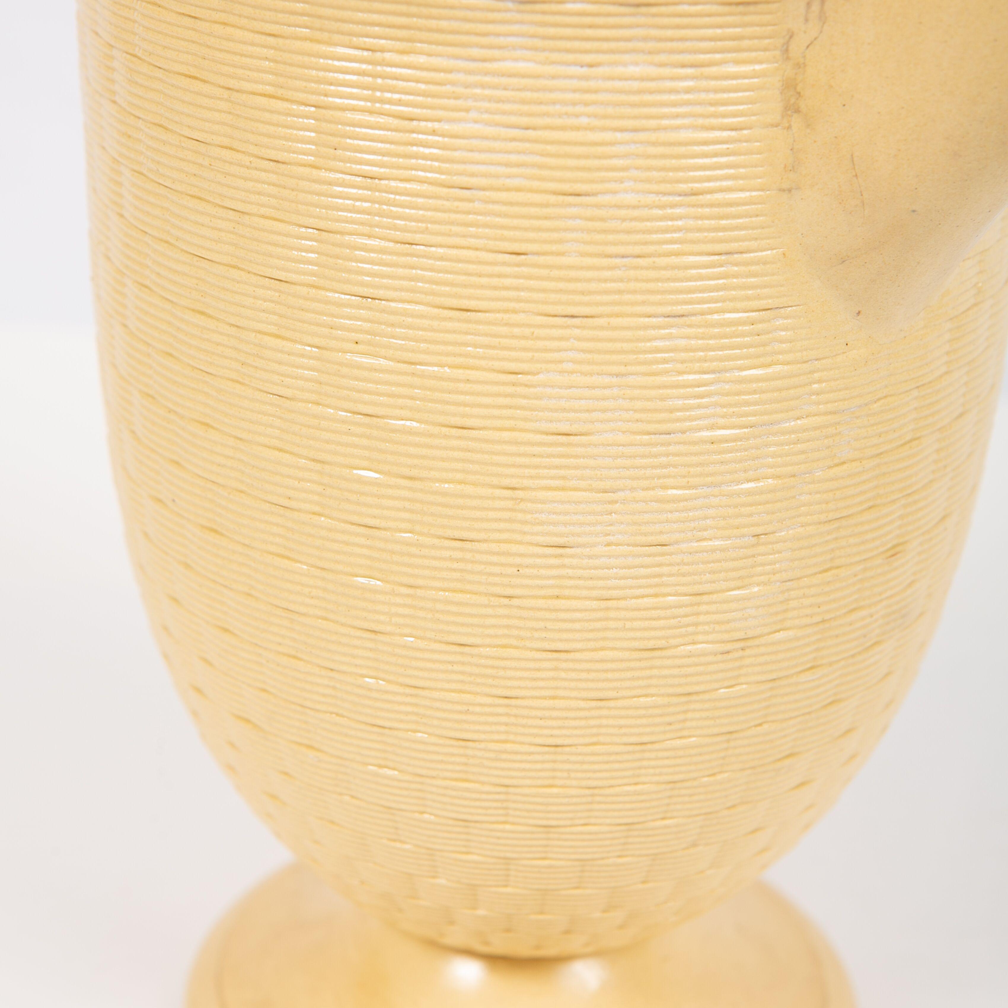 The luscious cane-yellow color of this coffee pot was a Wedgwood specialty in the 1830s. The inspiration for this special color was fields of wheat. So it makes sense that the finial on the cover was made in the form of a sheaf of wheat. 
Both the