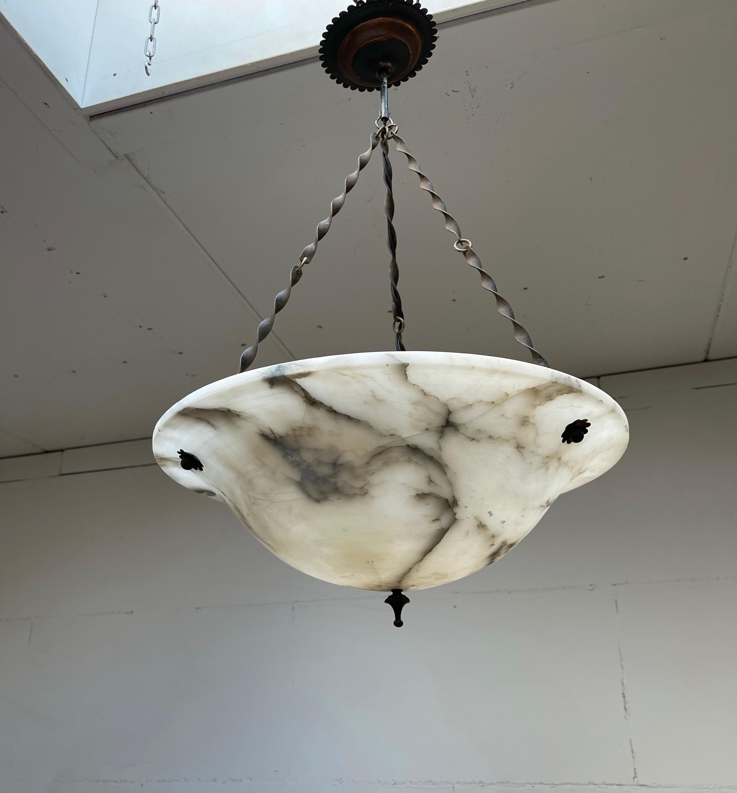 Vintage and great condition large white mineral stone with black veins ceiling lamp.

For the private buyers and interior designers we also have this large and white alabaster pendant. Its impressive size and unique chain of twisted brass with a