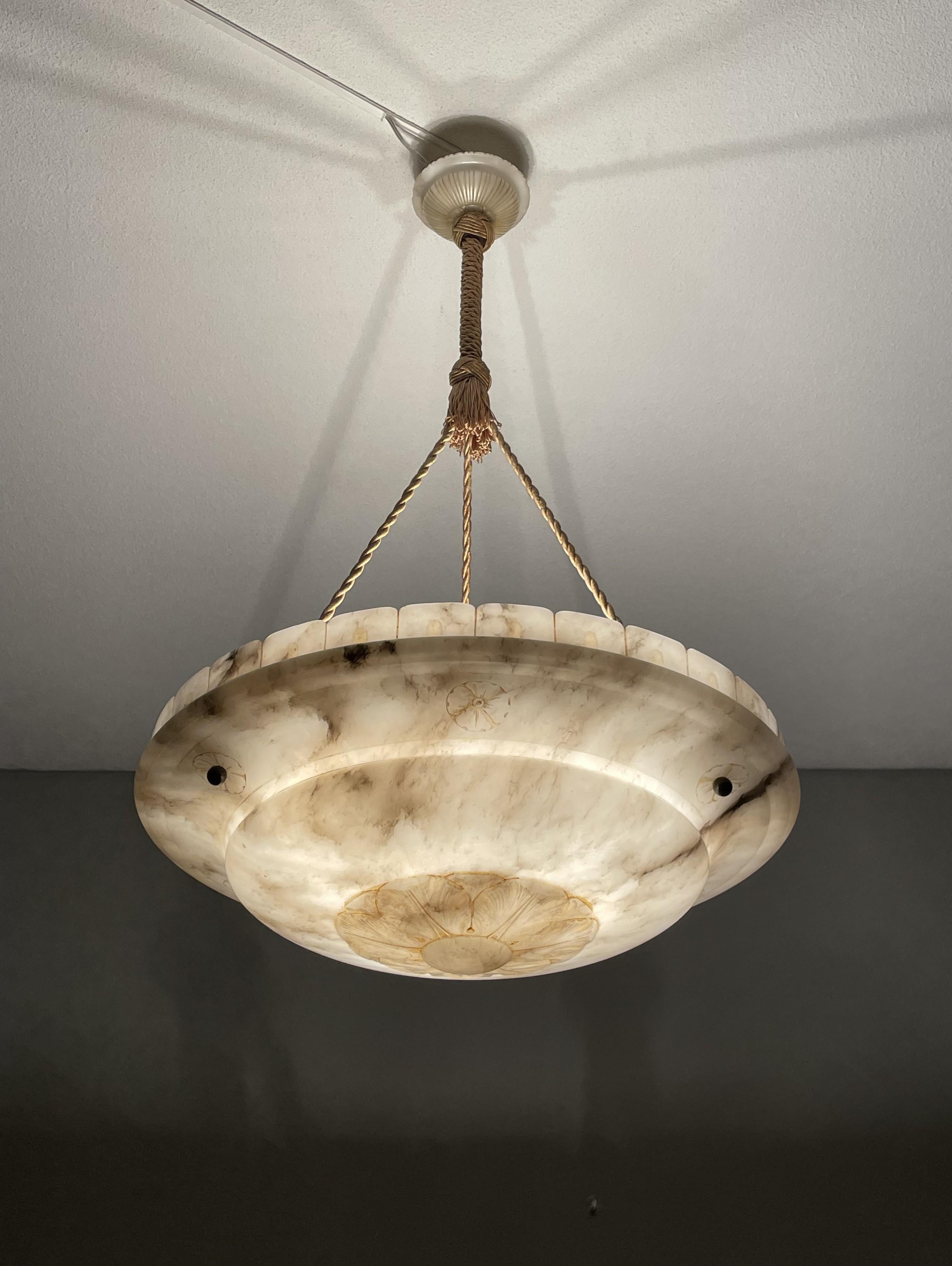 Top class, hand carved three-light alabaster chandelier.

Thanks to its unique design, aesthetic beauty, large size and superb condition this antique alabaster chandelier is bound to light up both your days and evenings. It is all hand-crafted in