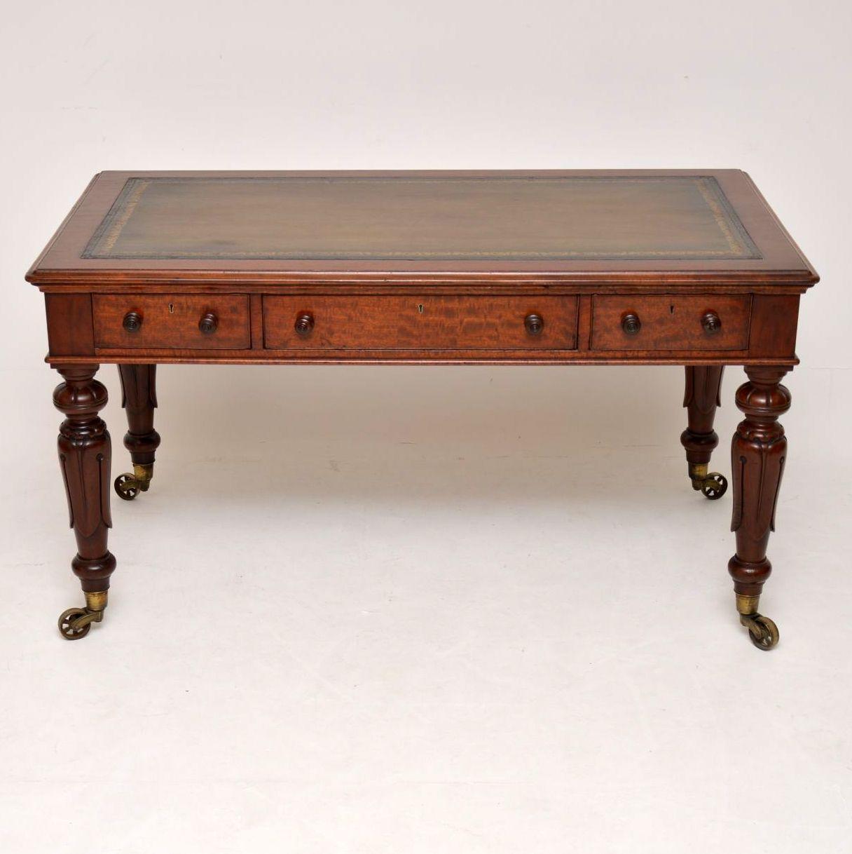 This large antique William IV mahogany writing table is one of the best examples of this sort of thing that I have seen and it has some wonderful features. It has a hand colored tooled leather writing surface with three drawers below and a polished