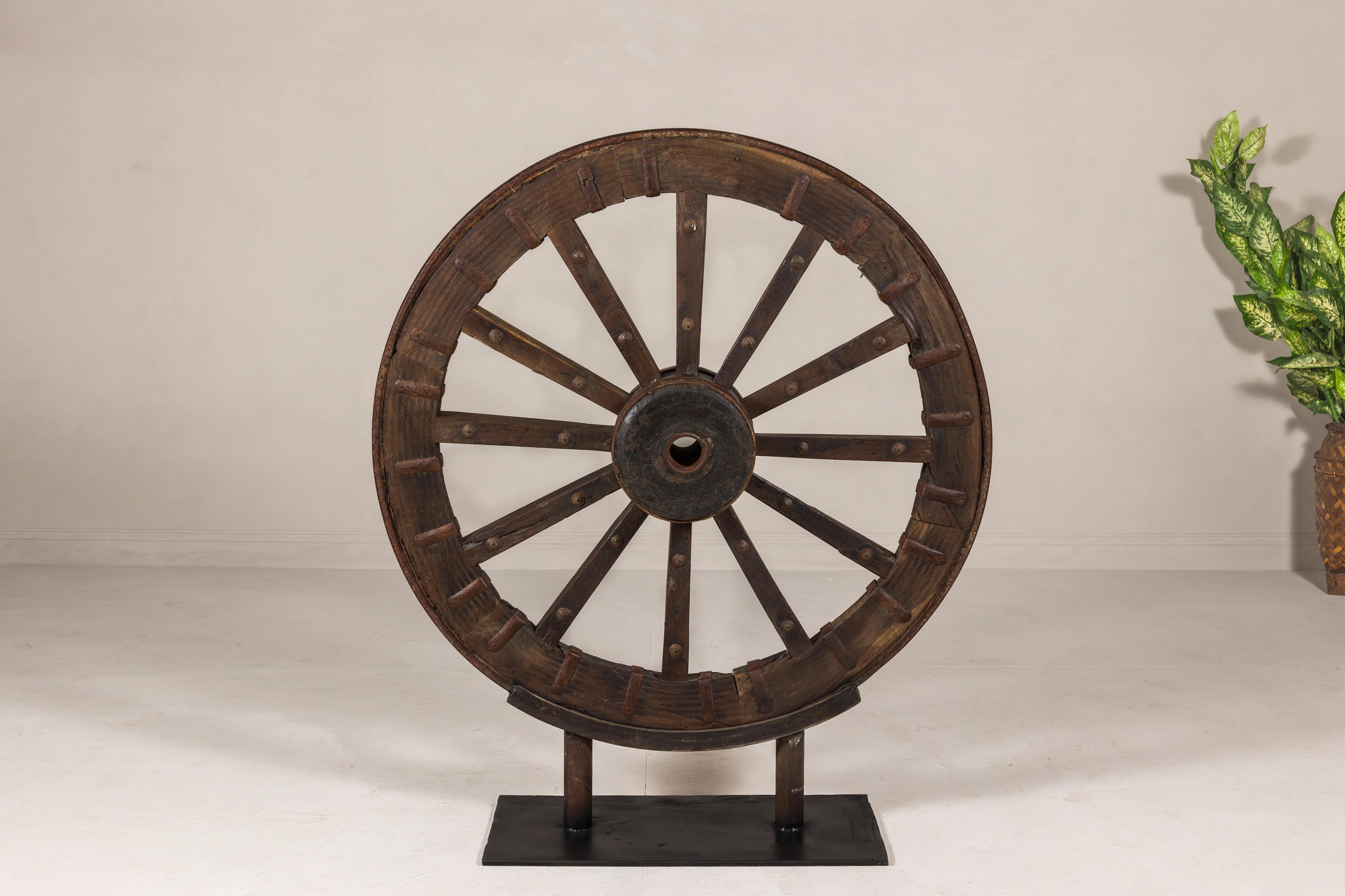 Indian Large Antique Wood and Metal Cart Wheel Mounted on Custom Base For Sale