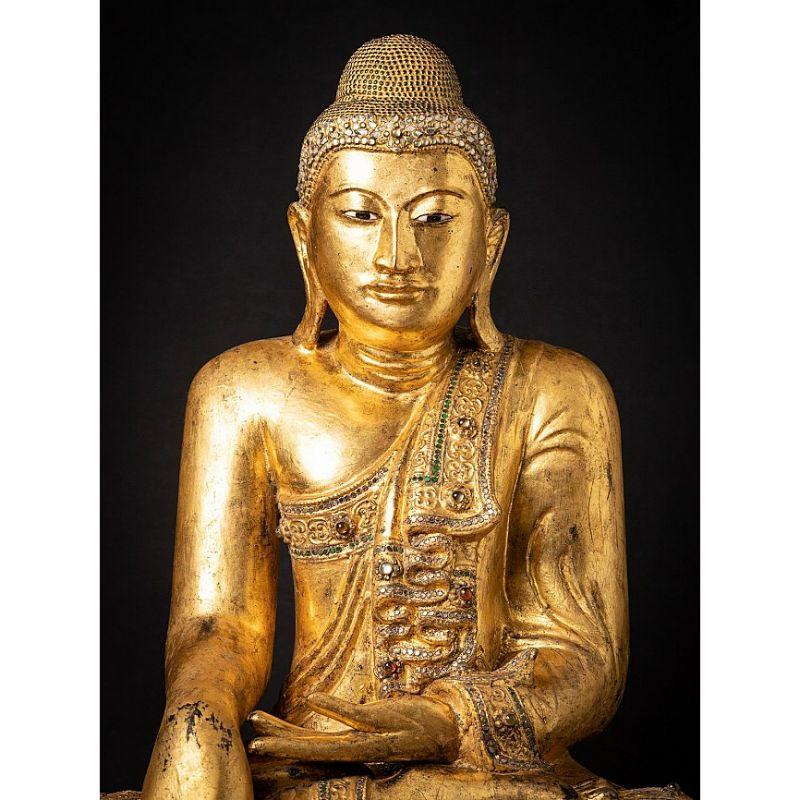 Material: wood
Measures: 81 cm high 
64 cm wide and 43,5 cm deep
Gilded with 24 krt. gold
Mandalay style
Bhumisparsha mudra
Originating from Burma
19th century
A beautiful piece !

