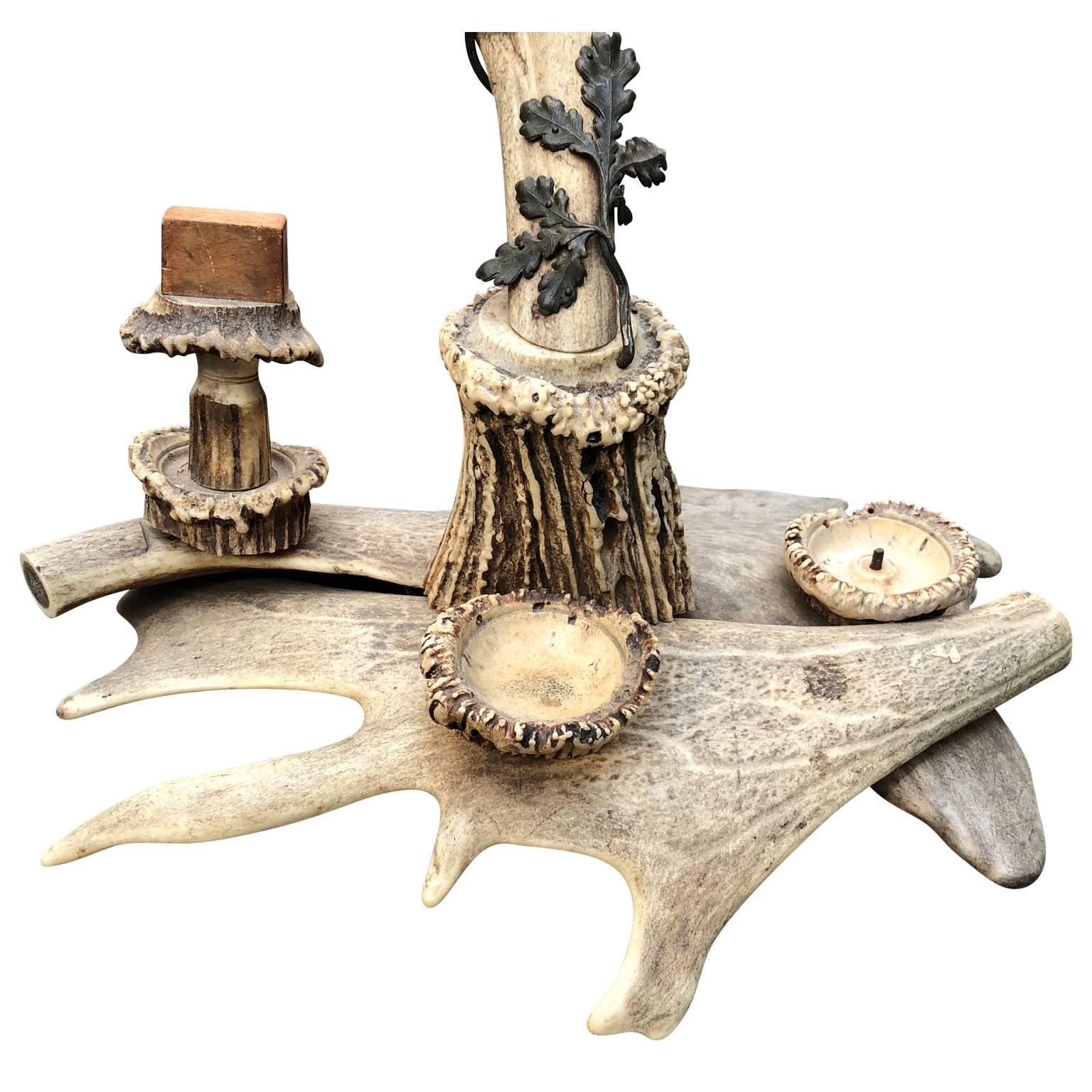 Large antler table clock, centerpiece and smoke stand.