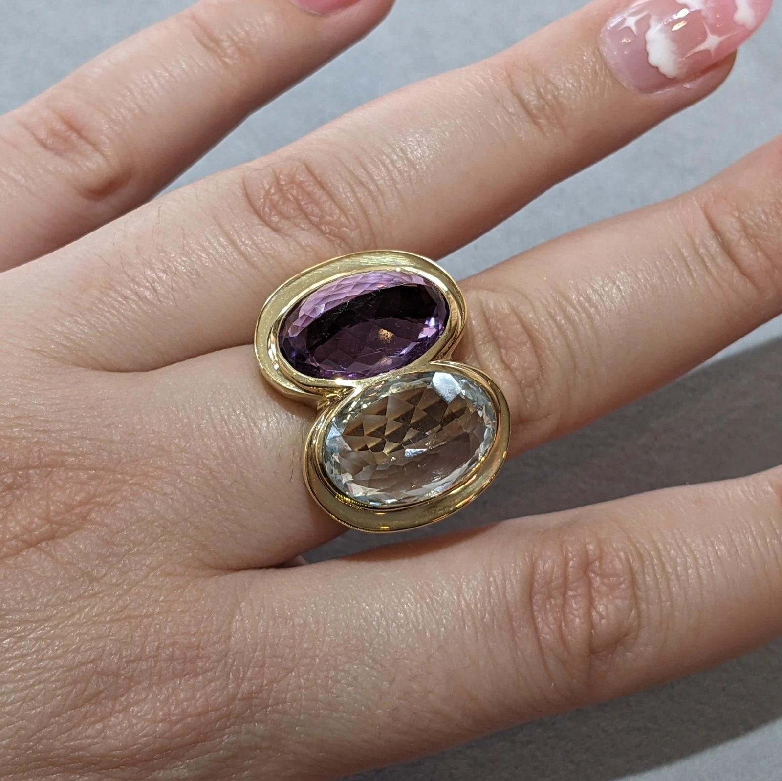 Large Aquamarine and Amethyst Statement Ring in 18k Yellow Gold

Large Stone Ring features large faceted Oval Amethyst and Aquamarine both have been set inverted and vertically in 18k Yellow Gold.

Ring size is 9.5
Ring measures 1.10 inches across