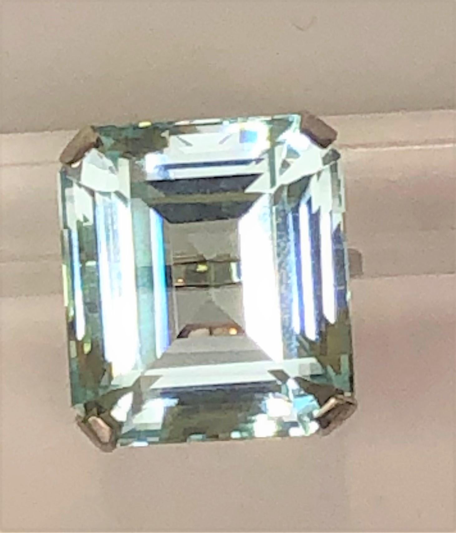 This ring will definitely get noticed for it's beautiful color and shine!
14 karat white mounting
Approximately 30 carat blue, emerald cut aquamarine in a decorative basket setting
Stone measures approximately 20.6mm x 18.4mm x 12.3mm, approximately