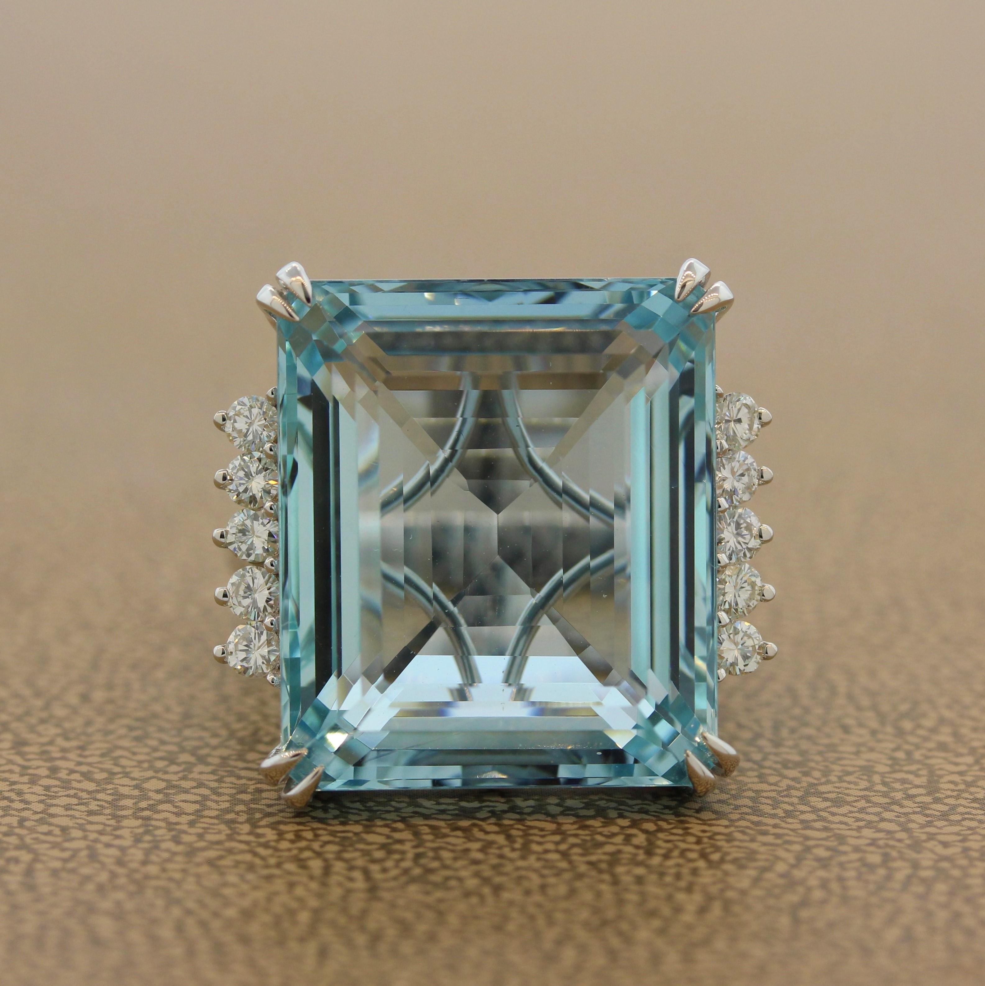 This bold ring features a 33.94 carat ocean blue aquamarine. The emerald cut aquamarine is set in 18K white gold with 0.58 carats of round cut diamonds accenting two sides. Simple yet elegant, this ring can be worn casually or dressed up for a night