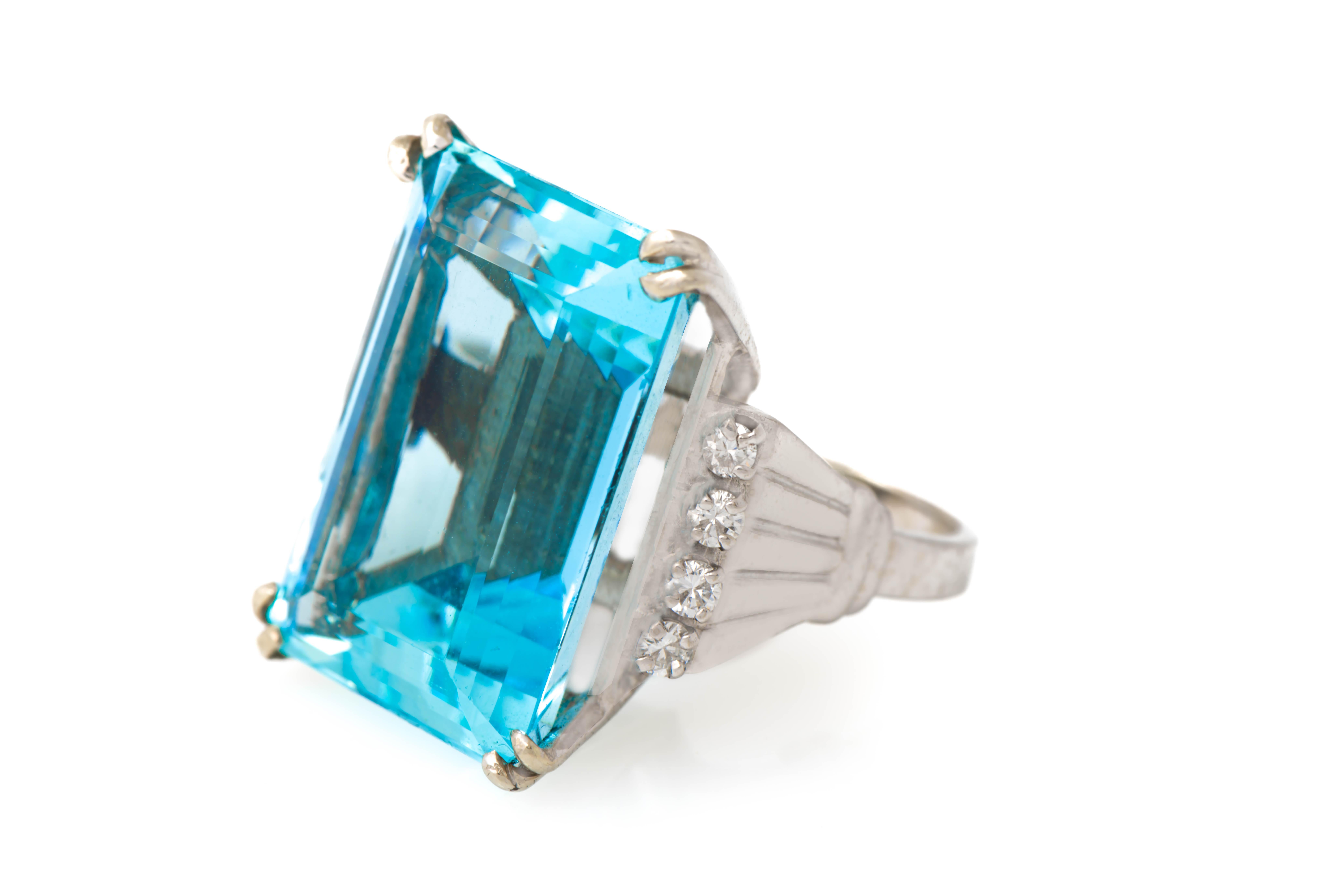 Large Aquamarine & Diamond Ring 

1 emerald cut aquamarine surrounded by 8 round cut diamonds set in 14k white gold.

Ring Size: 6.25

Resizable free of charge 