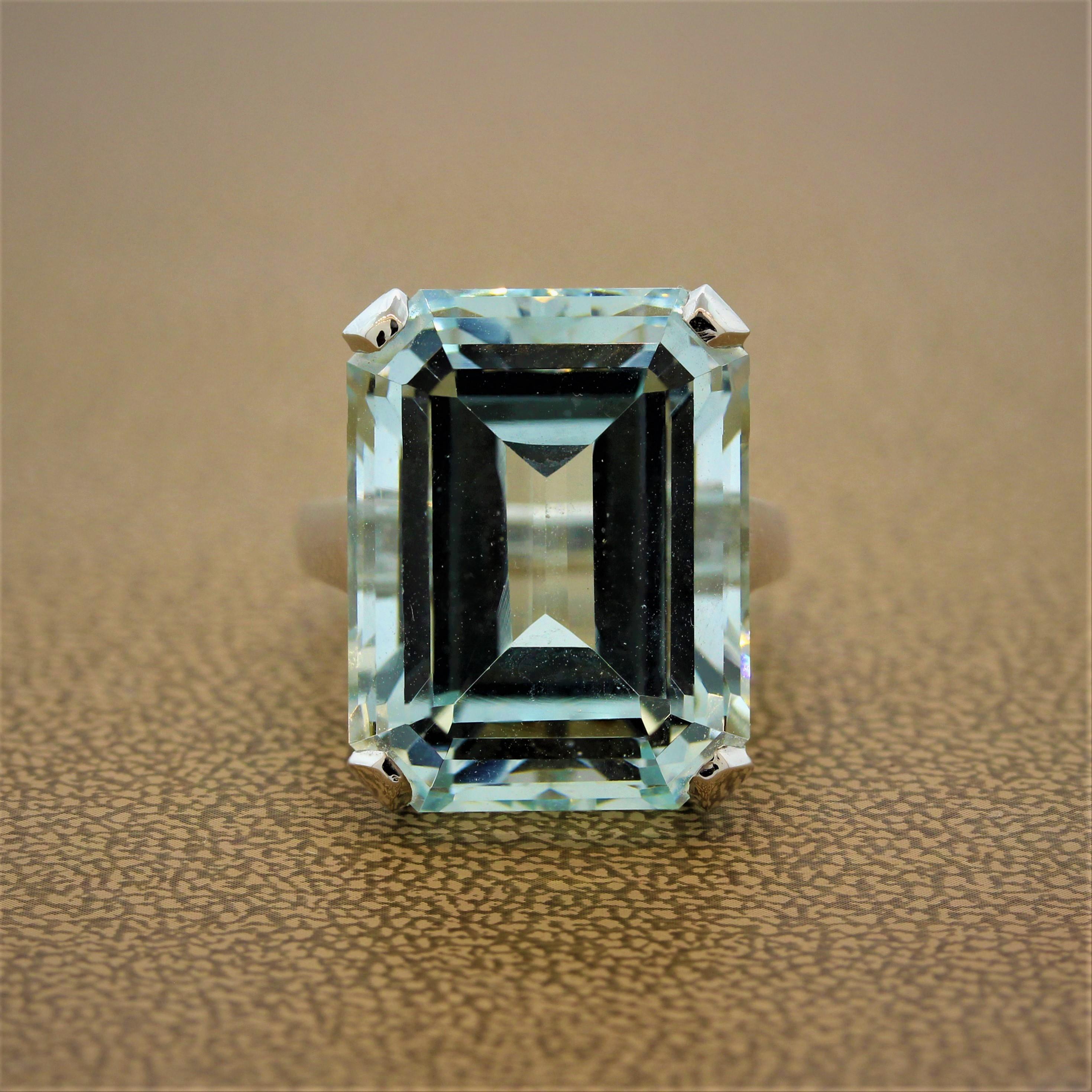 Make a statement with this estate ring featuring a 29.12 carat aquamarine. This solitaire emerald cut aquamarine is set in a 14K white gold basket setting. A versatile ring to complement any day or night outfit and can easily be dressed up or worn