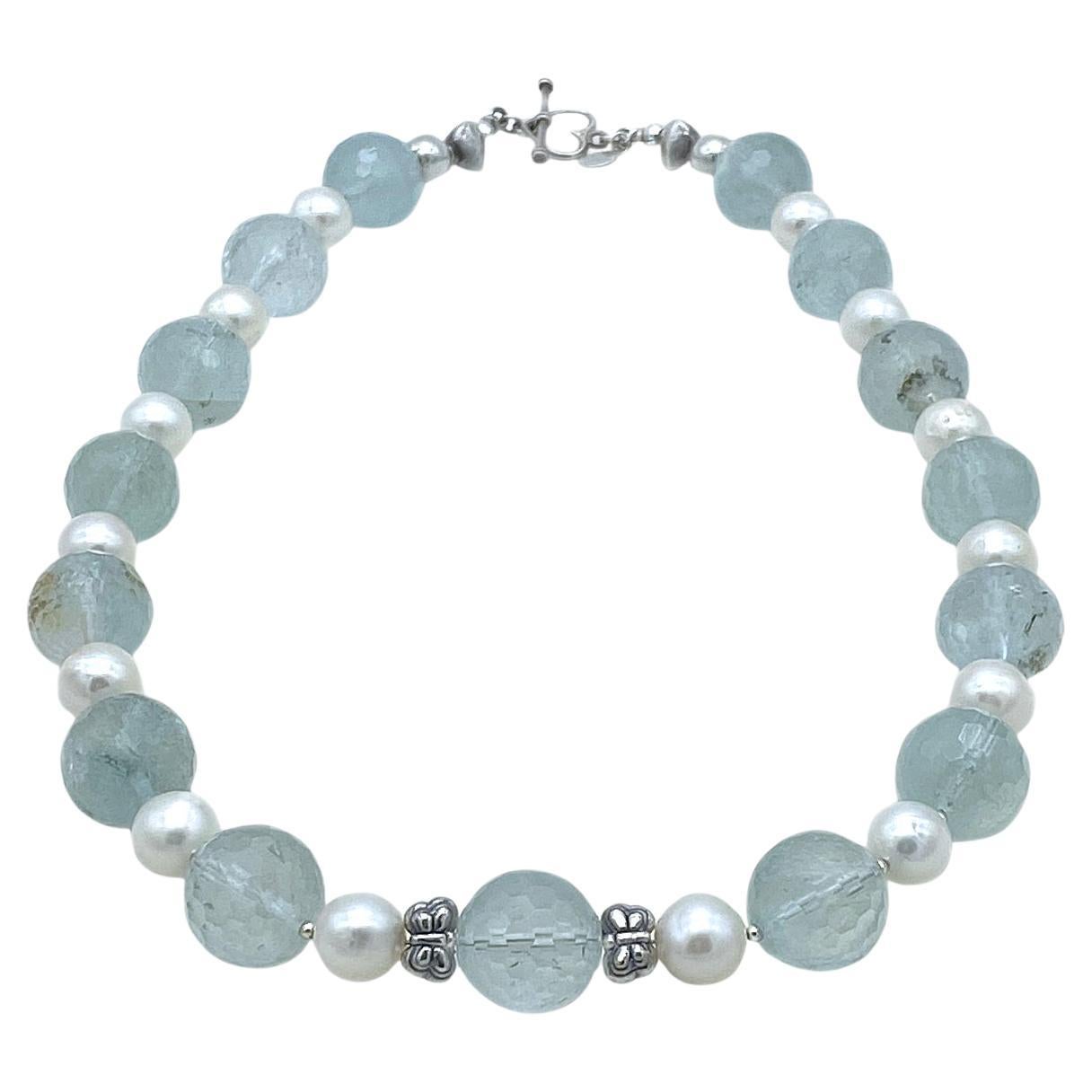This is a aquamarine and pearl necklace. We created it with 15 mm faceted frosted lite blue aquamarine and 10mm round freshwater pearls. It comes with sterling components. These large frosted gemstones and pearls are a perfect addition to your